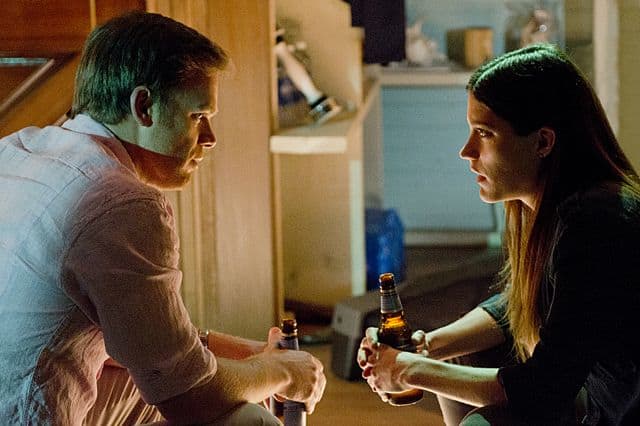 Michael C. Hall as Dexter Morgan and Jennifer Carpenter as Debra Morgan in Dexter (Season 8, episode 10)