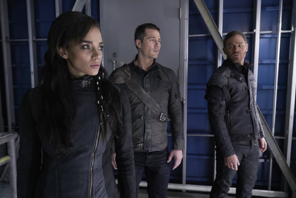 KILLJOYS -- "The Hullen Have Eyes" Episode 303 -- Pictured: (l-r) Hannah John-Kamen as Dutch, Luke Macfarlane as D'Avin, Aaron Ashmore as John -- (Photo by: Steve Wilkie/Killjoys III Productions Limited/Syfy)