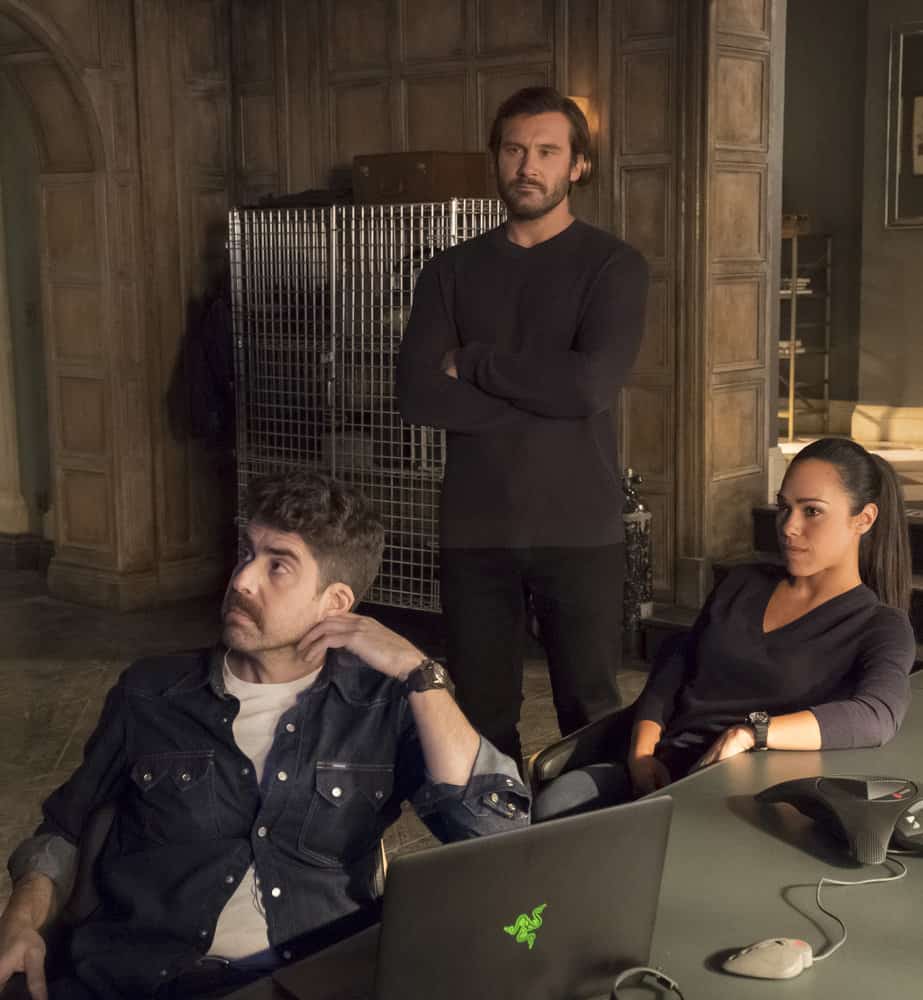 TAKEN -- "Invitation Only" Episode 207 -- Pictured: (l-r) Adam Goldberg as Kilroy, Clive Standen as Bryan Mills, Jessica Camacho as Santana -- (Photo by: Panagiotis Pantazidis/NBC)