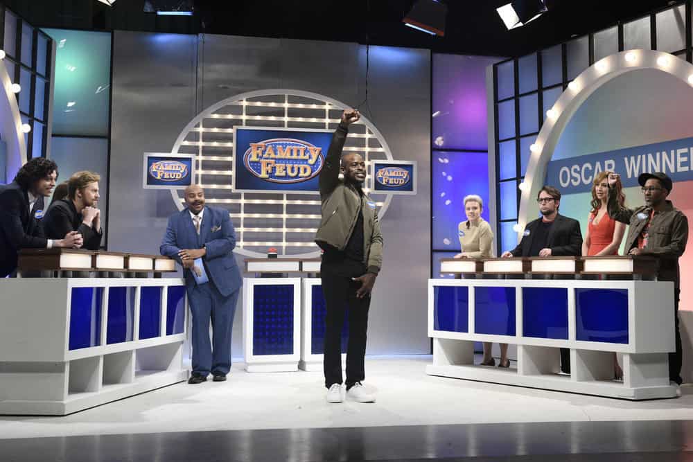 SATURDAY NIGHT LIVE -- Episode 1740 "Sterling K. Brown" -- Pictured: (l-r) Pete Davidson as Timothée Chalamet, Alex Moffat, Kenan Thomson as Steve Harvey, Sterling K. Brown as Common, Kate McKinnon as Frances McDermott, Beck Bennett as Guillermo del Toro, Heidi Gardner as Allison Williams, Chris Redd as Jordan Peele during "Family Feud Oscars Edition" in Studio 8H on Saturday, March 10, 2018 -- (Photo by: Will Heath/NBC)
