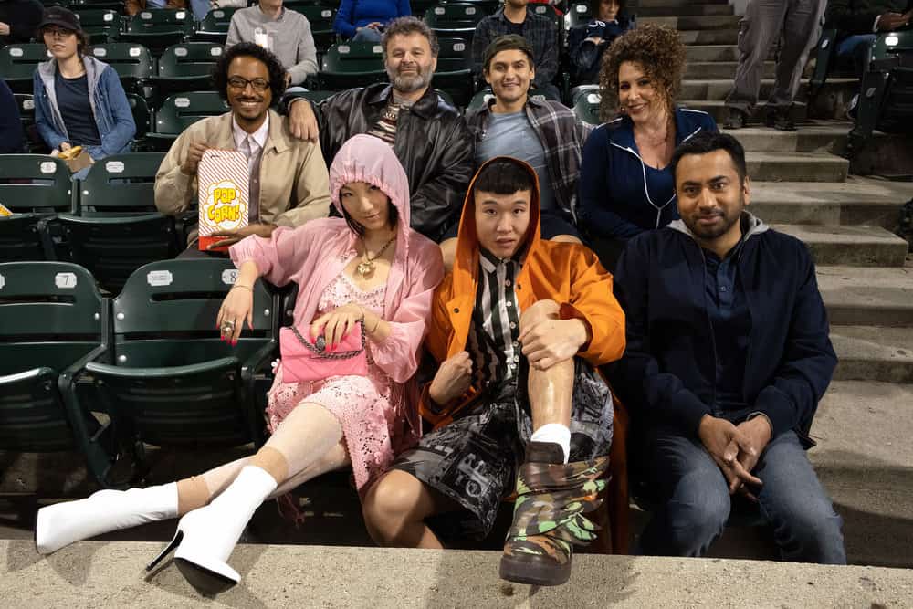SUNNYSIDE -- "Pilot" Episode -- Pictured: (Back Row l-r) Samba Schutte as Hakim, Tudor Petrut as Drazen, Moses Storm as Brady, Diana Marie Riva as Griselda,(Front Row l-r) Poppy Liu as Mei Lin, Joel Kim Booster as Jun Ho, Kal Penn as Garrett -- (Photo by: Colleen Hayes/NBC) SUNNYSIDE -- "Pilot" Episode -- Pictured: (Back Row l-r) Samba Schutte as Hakim, Tudor Petrut as Drazen, Moses Storm as Brady, Diana Marie Riva as Griselda,(Front Row l-r) Poppy Liu as Mei Lin, Joel Kim Booster as Jun Ho, Kal Penn as Garrett -- (Photo by: Colleen Hayes/NBC)