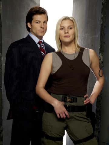 BATTLESTAR GALACTICA -- Pictured: (l-r) Jamie Bamber as Lee "Apollo" Adama, Katee Sackhoff as Kara "Starbuck" Thrace -- SCI FI Channel Photo: Justin Stephens