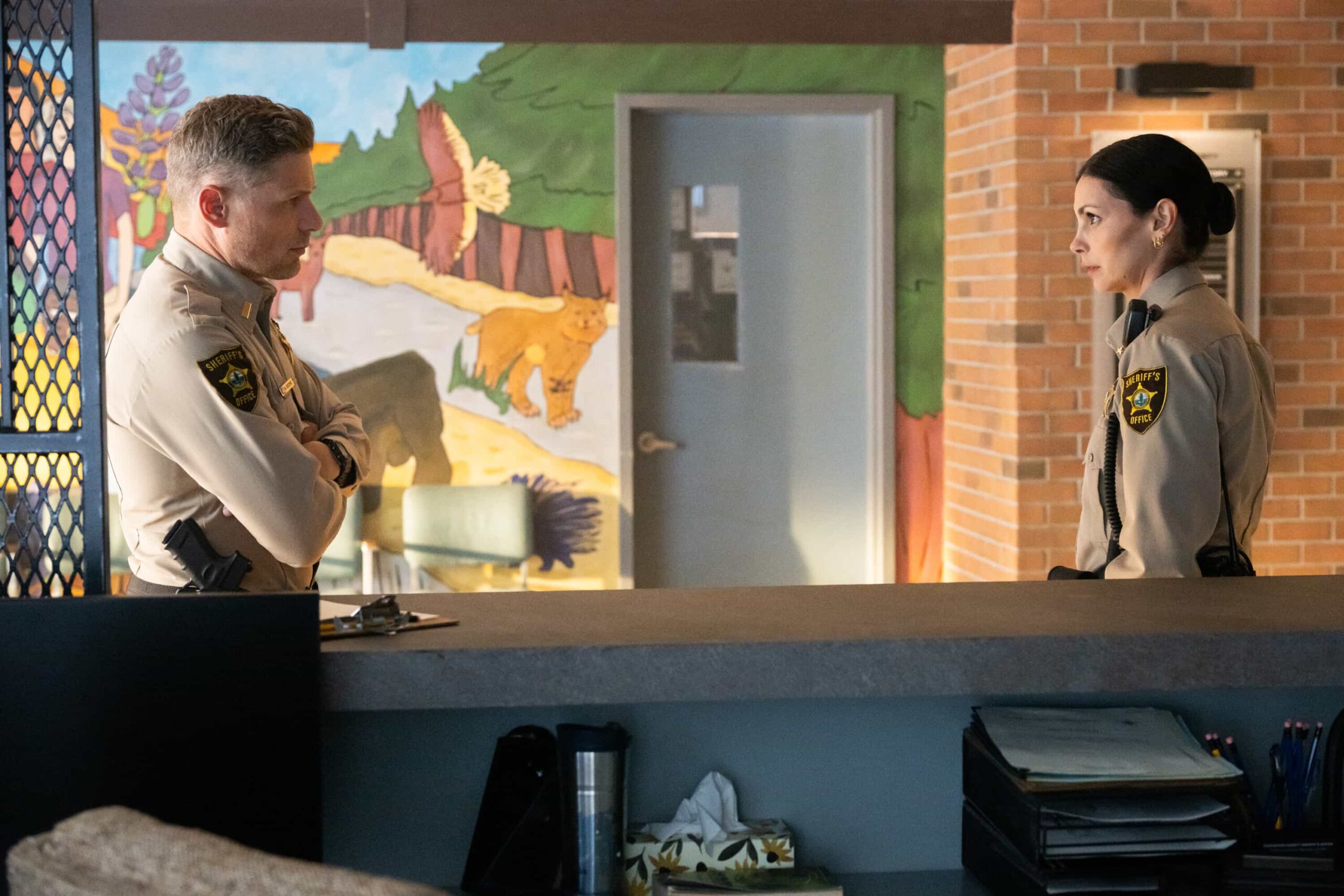 “The Sixth Man” – When a daring daylight robbery shakes the heart of Edgewater, Sheriff Mickey Fox must navigate rising tensions, personal entanglements and a town quick to judge. Meanwhile, suspicions swirl around her daughter, Skye, and her involvement in a high-profile murder case, on SHERIFF COUNTRY, Friday, Oct. 31 (8:00-9:00 PM, ET/PT) on the CBS Television Network, and streaming on Paramount+ (live and on-demand for Paramount+ Premium plan subscribers, or on-demand for Paramount+ Essential subscribers the day after the episode airs)*. Pictured: Matt Lauria as Nathan Boone and Morena Baccarin as Sheriff Mickey Fox. Photo: Christos Kalohoridis/CBS ©2025 CBS Broadcasting, Inc. All Rights Reserved.