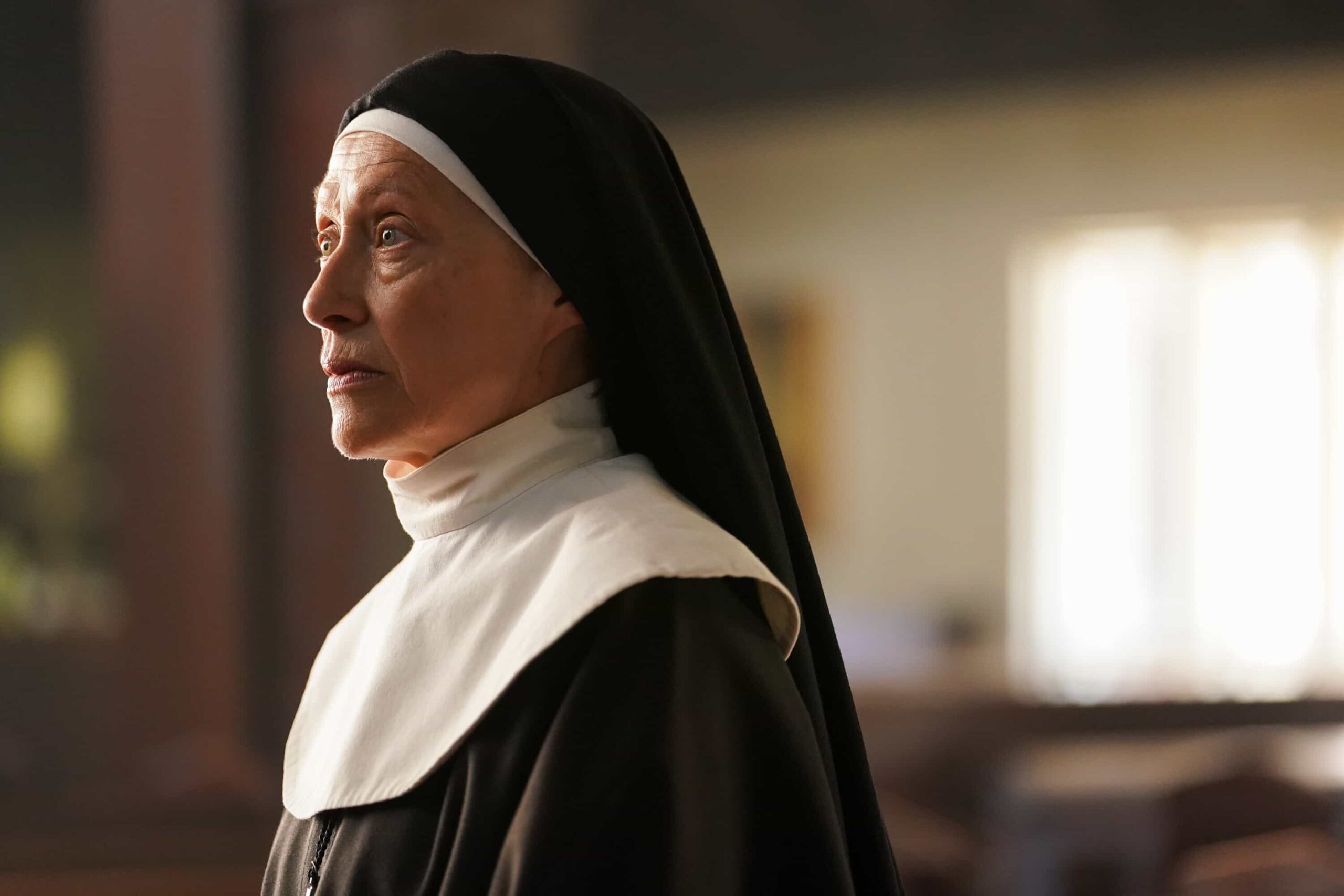 “First Fire” – On Halloween night, when a nurse is murdered and arsonist Heston Koontz disappears from a psychiatric facility, Colter follows a trail of unsettling clues to uncover the truth with assistance from local officer Dundee on TRACKER, Sunday, Nov. 2 (8:30-9:30 PM, ET/PT) on the CBS Television Network, and streaming on Paramount+ (live and on-demand for Paramount+ Premium plan subscribers, or on-demand for Paramount+ Essential subscribers the day after the episode airs)*. Pictured: Karin Konoval as Mother Superior. Photo: Darko Sikman/CBS ©2025 CBS Broadcasting, Inc. All Rights Reserved.