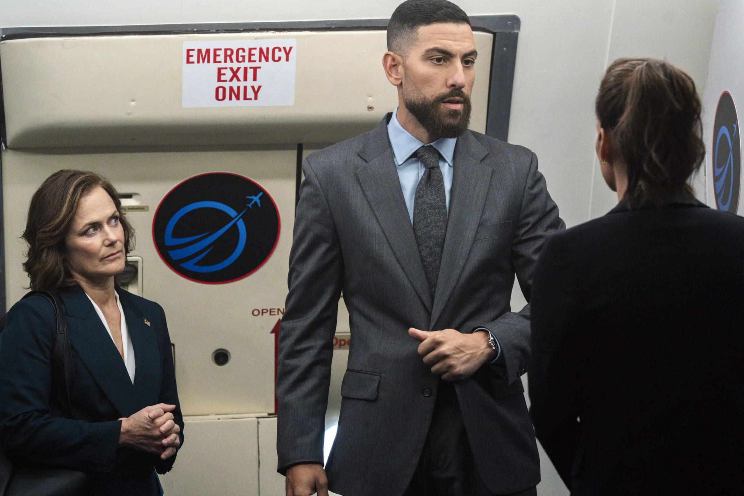 FBI Season 8 Episode 4 “Manifest” – Following a failed assassination attempt on a U.S. senator, OA and Maggie are tasked with escorting her back to Washington, D.C. on a flight that becomes more perilous than imagined, on FBI, Monday, Nov. 3 (9:00-10:00 PM, ET/PT) on the CBS Television Network, and streaming on Paramount+ (live and on-demand for Paramount+ Premium plan subscribers, or on-demand for Paramount+ Essential subscribers the day after the episode airs).   Pictured (L-R): Sarah Clarke as Senator Charlotte Hirsch and Zeeko Zaki as Special Agent Omar Adom ‘OA’ Zidan. Photo: Bennett Raglin/CBS ©2025 CBS Broadcasting, Inc. All Rights Reserved.