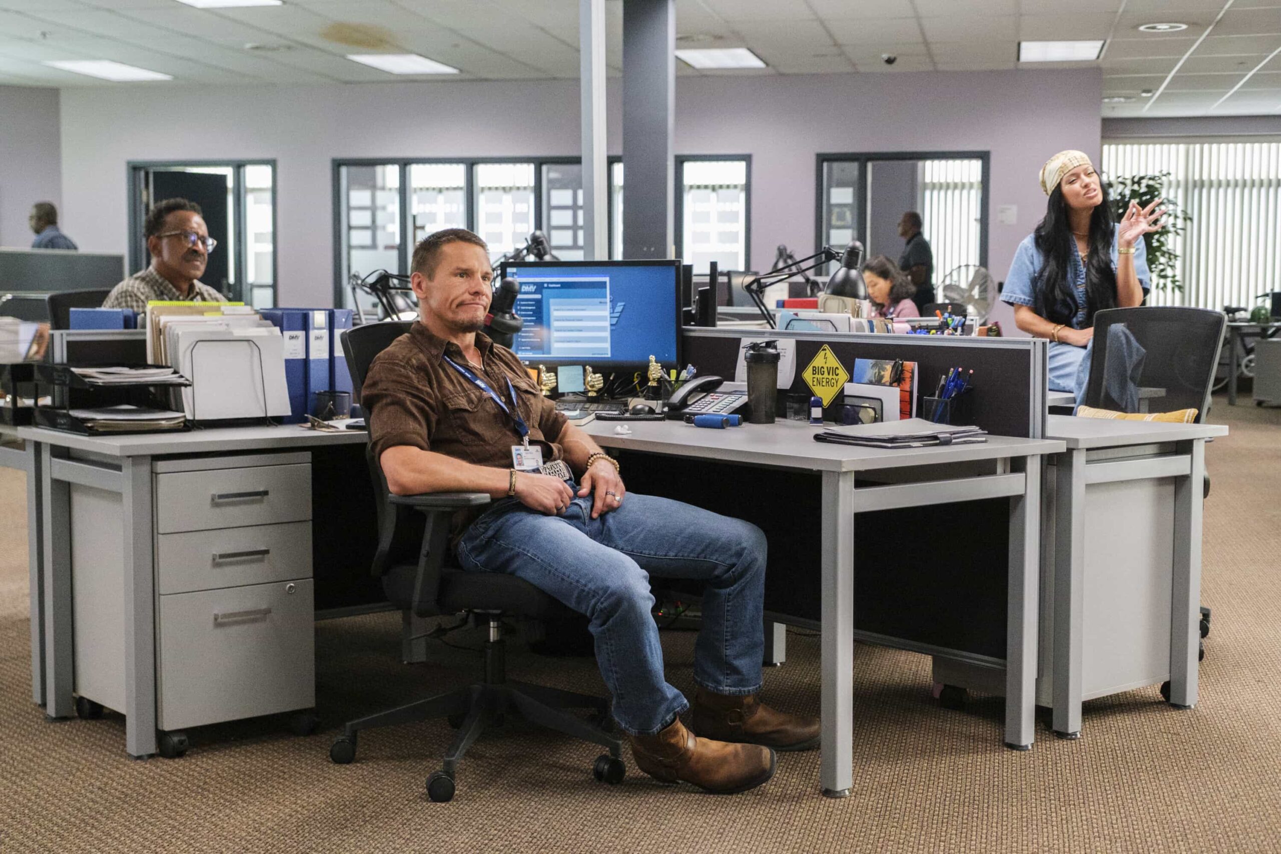 “Stick Shift” – When Ceci accuses Colette of only being kind for the credit, Colette anonymously gives Noa the perfect gift, on DMV, Monday, Nov. 10 (8:30-9:00 PM, ET/PT) on the CBS Television Network, and streaming on Paramount+ (live and on-demand for Paramount+ Premium plan subscribers, or on-demand for Paramount+ Essential subscribers the day after the episode airs)*. Pictured L to R:  Tim Meadows as Gregg, Tony Cavalero as Vic and Gigi Zumbado as Ceci. Photo: Bertrand Calmeau/CBS ©2025 CBS Broadcasting, Inc. All Rights Reserved.