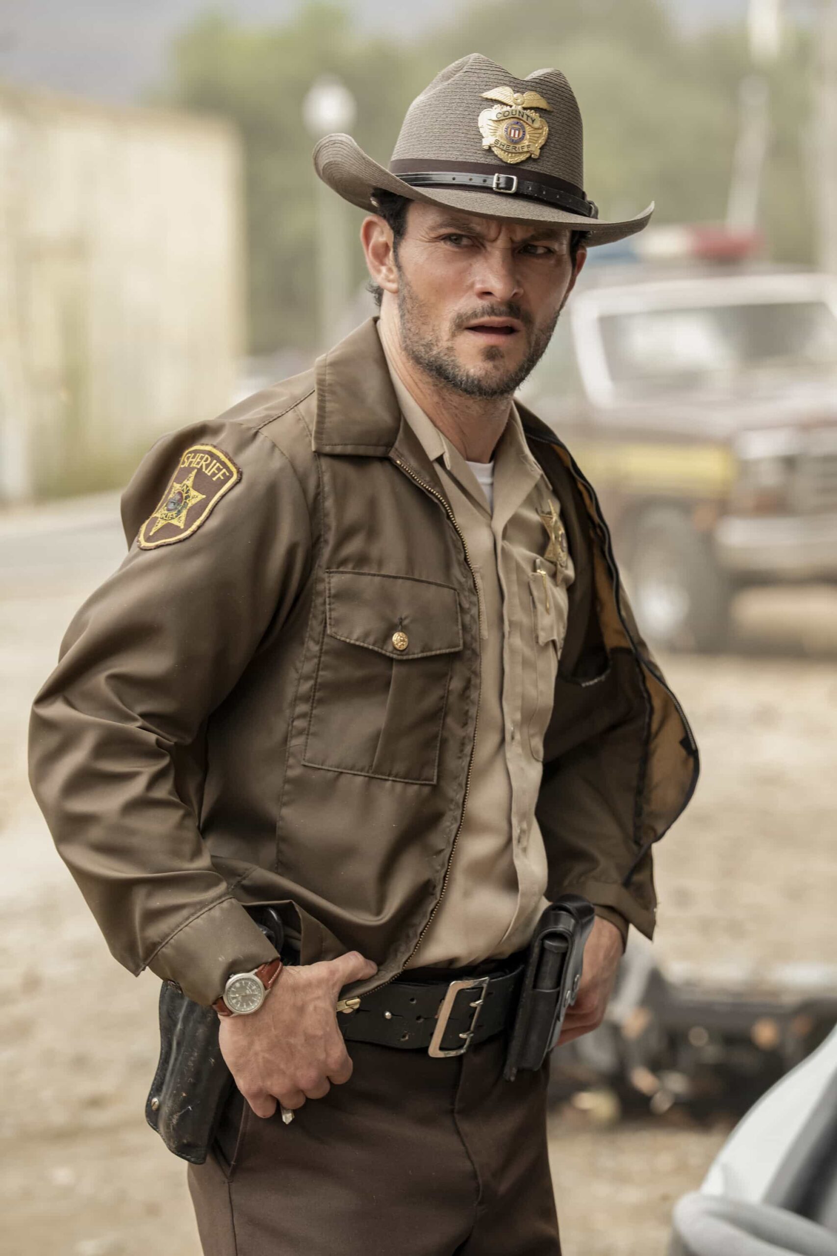 “Funny How Time Slips Away” – When a naval officer mysteriously dies in the ‘90s, Gibbs (Austin Stowell) and the team travel to the small dust-blown town of Serenity, Calif., where they encounter secret-harboring residents, an uncooperative sheriff and an investigation that will reverberate for decades, on the first part of the NCIS crossover event on NCIS: ORIGINS, Tuesday, Nov. 11 (8:00-9:00 PM, ET/PT) on the CBS Television Network, and streaming on Paramount+ (live and on demand for Paramount+ Premium plan subscribers, or on demand for Paramount+ Essential subscribers the day after the episode airs)*. Mark Harmon returns to the role of Gibbs in a special guest appearance.  Pictured (L-R):   Photo: Greg Gayne/CBS ©2025 CBS Broadcasting, Inc. All Rights Reserved.