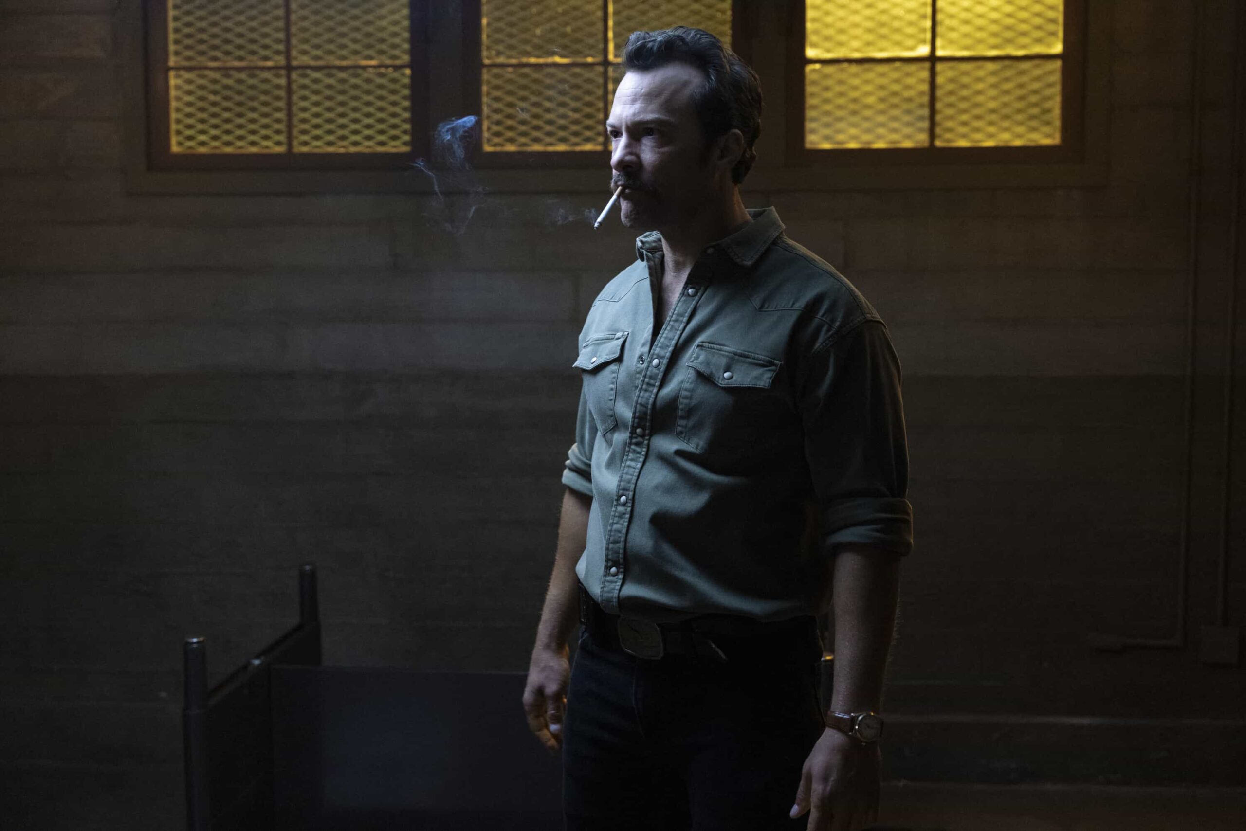 “Funny How Time Slips Away” – When a naval officer mysteriously dies in the ‘90s, Gibbs (Austin Stowell) and the team travel to the small dust-blown town of Serenity, Calif., where they encounter secret-harboring residents, an uncooperative sheriff and an investigation that will reverberate for decades, on the first part of the NCIS crossover event on NCIS: ORIGINS, Tuesday, Nov. 11 (8:00-9:00 PM, ET/PT) on the CBS Television Network, and streaming on Paramount+ (live and on demand for Paramount+ Premium plan subscribers, or on demand for Paramount+ Essential subscribers the day after the episode airs)*. Mark Harmon returns to the role of Gibbs in a special guest appearance.  Pictured (L-R): Kyle Schmid as Mike Franks.  Photo: Sonja Flemming/CBS ©2025 CBS Broadcasting, Inc. All Rights Reserved.