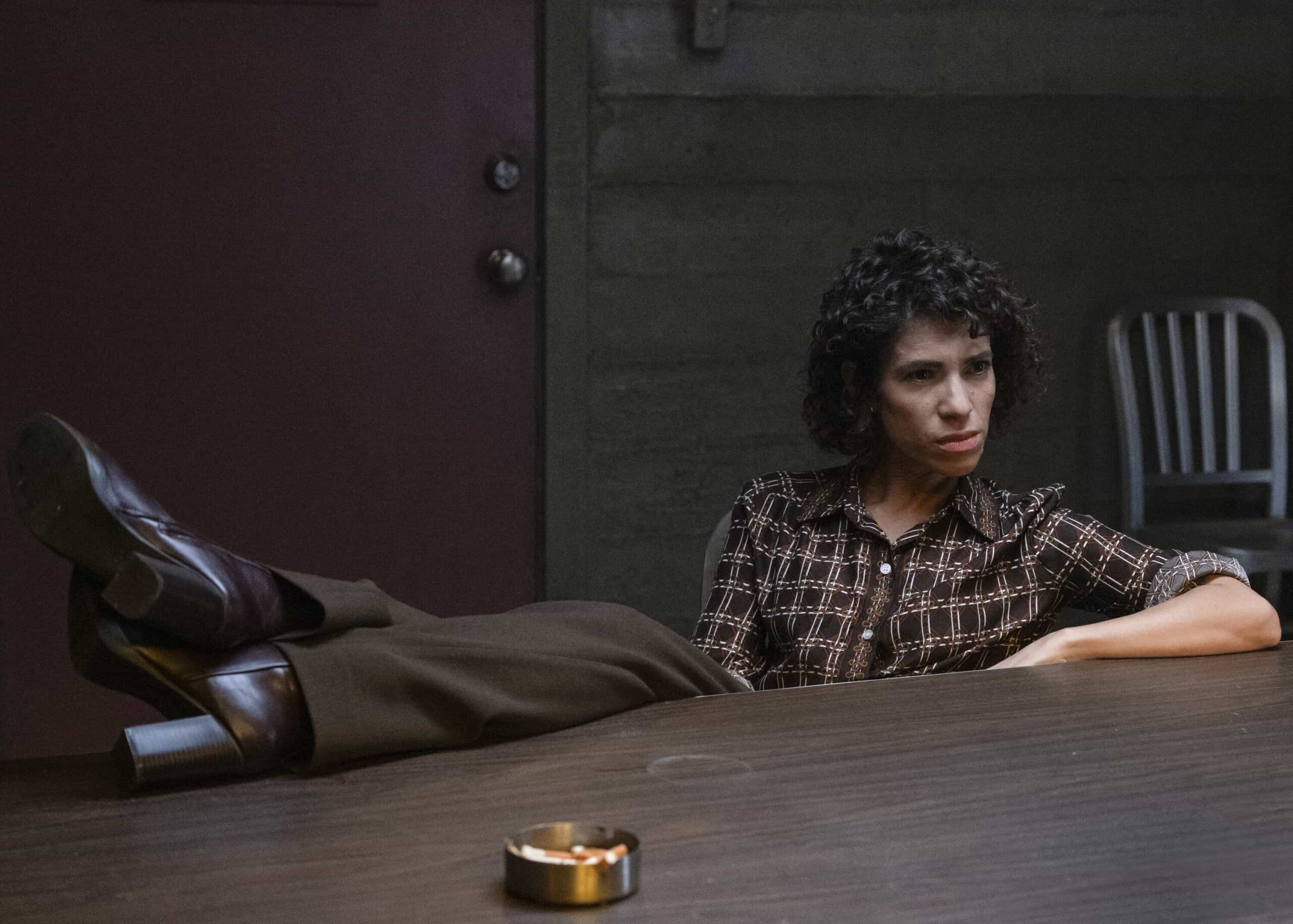 NCIS Origins Season 2 Episode 5 “Funny How Time Slips Away” – When a naval officer mysteriously dies in the ‘90s, Gibbs (Austin Stowell) and the team travel to the small dust-blown town of Serenity, Calif., where they encounter secret-harboring residents, an uncooperative sheriff and an investigation that will reverberate for decades, on the first part of the NCIS crossover event on NCIS: ORIGINS, Tuesday, Nov. 11 (8:00-9:00 PM, ET/PT) on the CBS Television Network, and streaming on Paramount+ (live and on demand for Paramount+ Premium plan subscribers, or on demand for Paramount+ Essential subscribers the day after the episode airs)*. Mark Harmon returns to the role of Gibbs in a special guest appearance.  Pictured (L-R): Diany Rodriguez as Vera Strickland.  Photo: Sonja Flemming/CBS ©2025 CBS Broadcasting, Inc. All Rights Reserved.