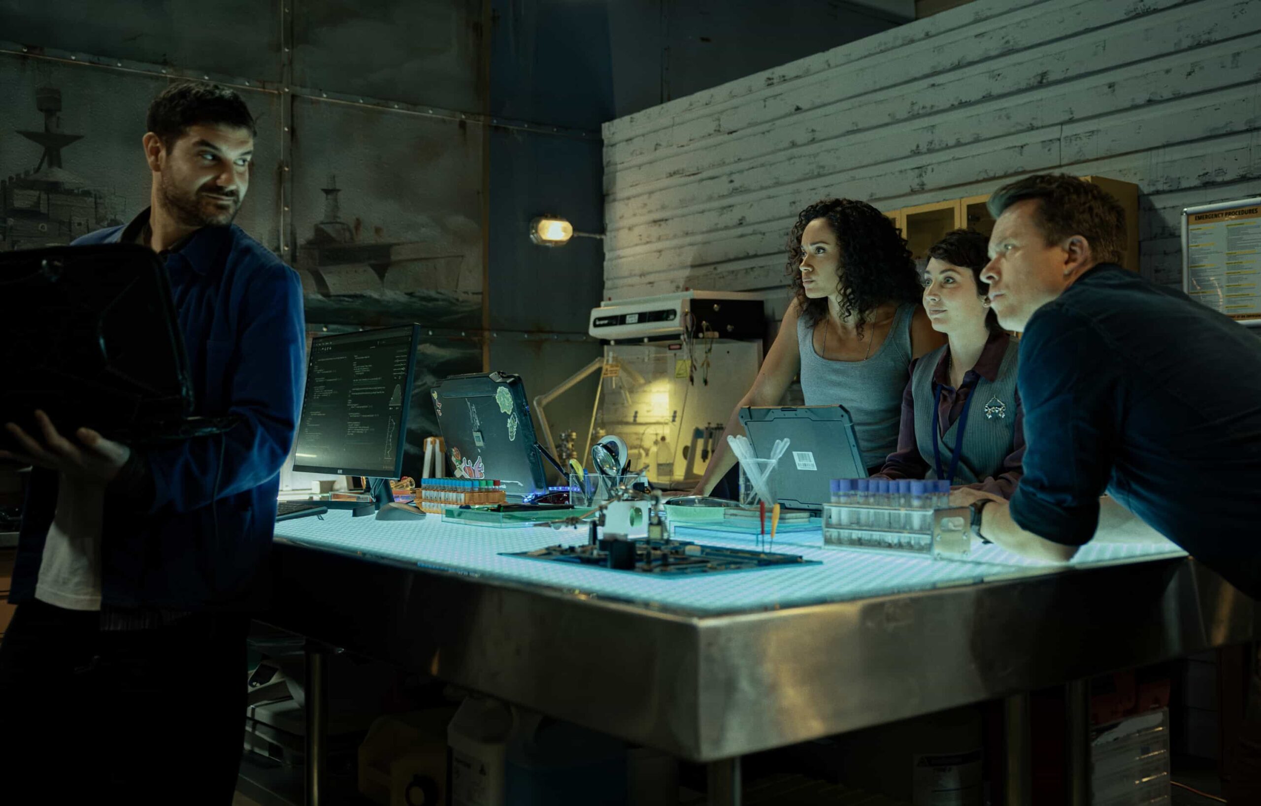 “Black Is White” – When a U.S. Navy attaché is found dead with a USB lodged in his throat, the team tracks a killer believed to have ties to an international chess tournament in Sydney, on NCIS: SYDNEY, Tuesday, Nov. 11 (10:00-11:00 PM, ET/PT) on the CBS Television Network, and streaming on Paramount+ (live and on demand for Paramount+ Premium plan subscribers, or on demand for Paramount+ Essential subscribers the day after the episode airs)*. L-R: Claude Jabbour as Travis “Trigger” Riggs, Olivia Swann as NCIS Special Agent Captain Michelle Mackey, Mavournee Hazel as Forensic Pathologist Bluebird \'Blue\' Gleeson and Todd Lasance as AFP Liaison Officer Sergeant Jim \'JD\' Dempsey in NCIS: Sydney episode 5, season 3 streaming on Paramount+, 2025. Photo Credit:  Daniel Asher Smith/Paramount+   © TM & © 2025 CBS Studios Inc. NCIS: Sydney and related marks and logos  are trademarks of CBS Studios Inc. All Rights Reserved.