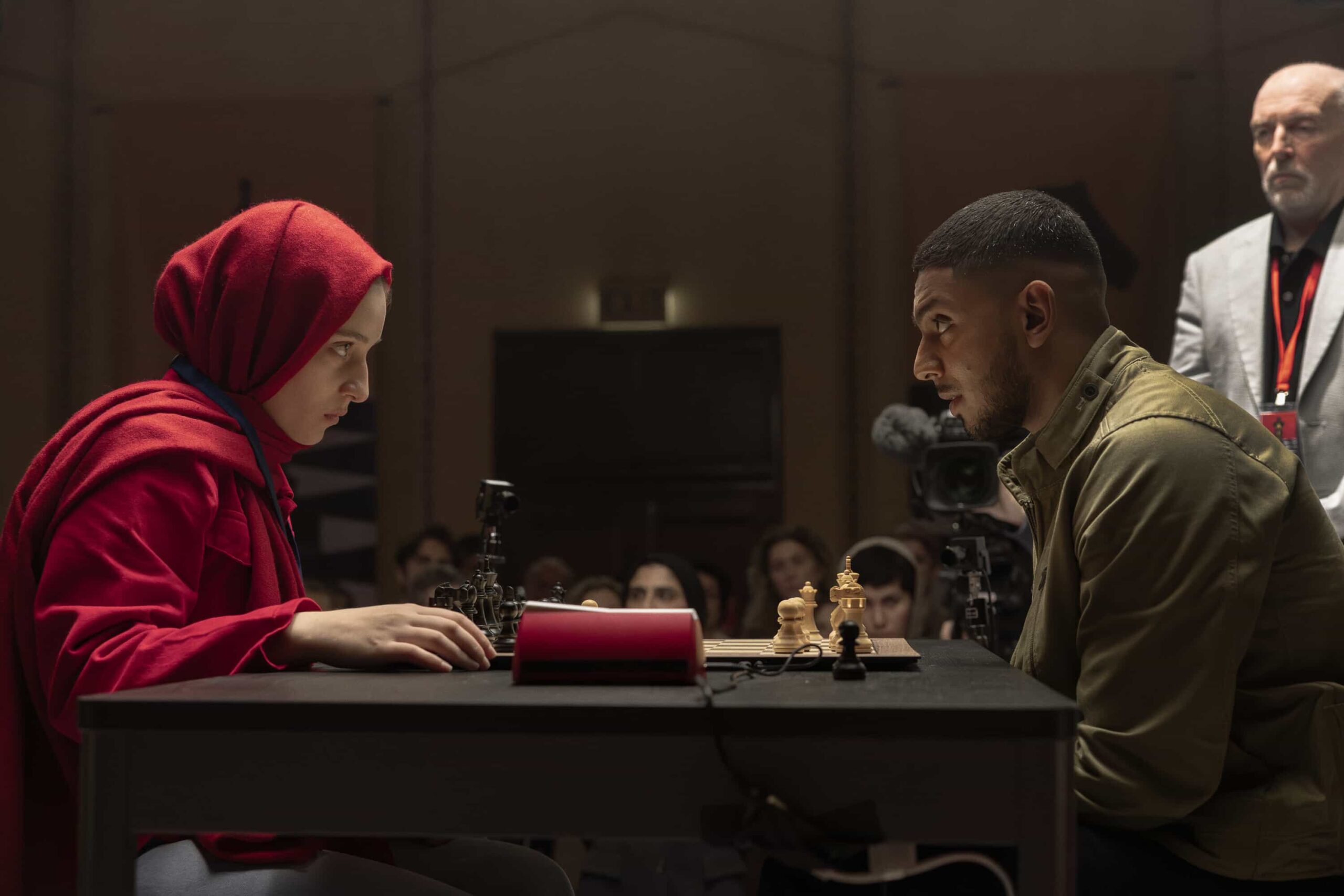 “Black Is White” – When a U.S. Navy attaché is found dead with a USB lodged in his throat, the team tracks a killer believed to have ties to an international chess tournament in Sydney, on NCIS: SYDNEY, Tuesday, Nov. 11 (10:00-11:00 PM, ET/PT) on the CBS Television Network, and streaming on Paramount+ (live and on demand for Paramount+ Premium plan subscribers, or on demand for Paramount+ Essential subscribers the day after the episode airs)*. L-R: Lily Montalto as Rana Azad and Sean Sagar as NCIS Special Agent DeShawn Jackson in NCIS: Sydney episode 5, season 3 streaming on Paramount+, 2025. Photo Credit:  Daniel Asher Smith/Paramount+   © TM & © 2025 CBS Studios Inc. NCIS: Sydney and related marks and logos  are trademarks of CBS Studios Inc. All Rights Reserved.