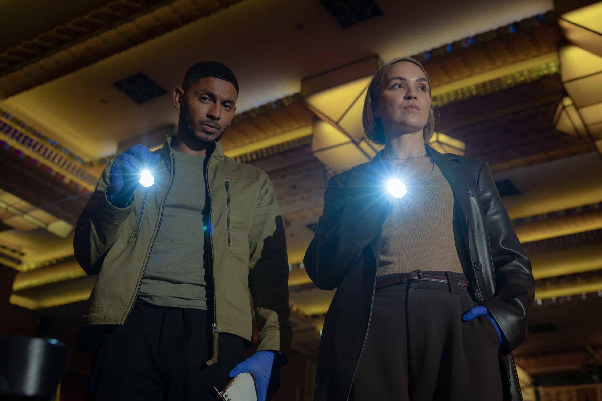 “Black Is White” – When a U.S. Navy attaché is found dead with a USB lodged in his throat, the team tracks a killer believed to have ties to an international chess tournament in Sydney, on NCIS: SYDNEY, Tuesday, Nov. 11 (10:00-11:00 PM, ET/PT) on the CBS Television Network, and streaming on Paramount+ (live and on demand for Paramount+ Premium plan subscribers, or on demand for Paramount+ Essential subscribers the day after the episode airs)*. Sean Sagar as NCIS Special Agent DeShawn Jackson and Tuuli Narkle as AFP Liaison Officer Constable Evie Cooper in NCIS: Sydney episode 5, season 3 streaming on Paramount+, 2025. Photo Credit:  Daniel Asher Smith/Paramount+   © TM & © 2025 CBS Studios Inc. NCIS: Sydney and related marks and logos  are trademarks of CBS Studios Inc. All Rights Reserved.