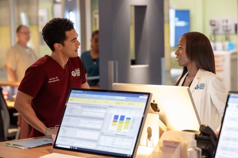 CHICAGO MED -- "Double Down" Episode 1107 -- Pictured: (l-r) Darren Barnet as Dr. John Frost, Ashlei Sharpe Chestnut as Dr. Naomi Howard -- (Photo by: George Burns Jr/NBC)