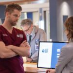 Chicago Med Season 11 episode 7 -- "Double Down" Episode 1107 -- Pictured: (l-r) Luke Mitchell as Dr. Mitch Ripley, -- (Photo by: George Burns Jr/NBC)