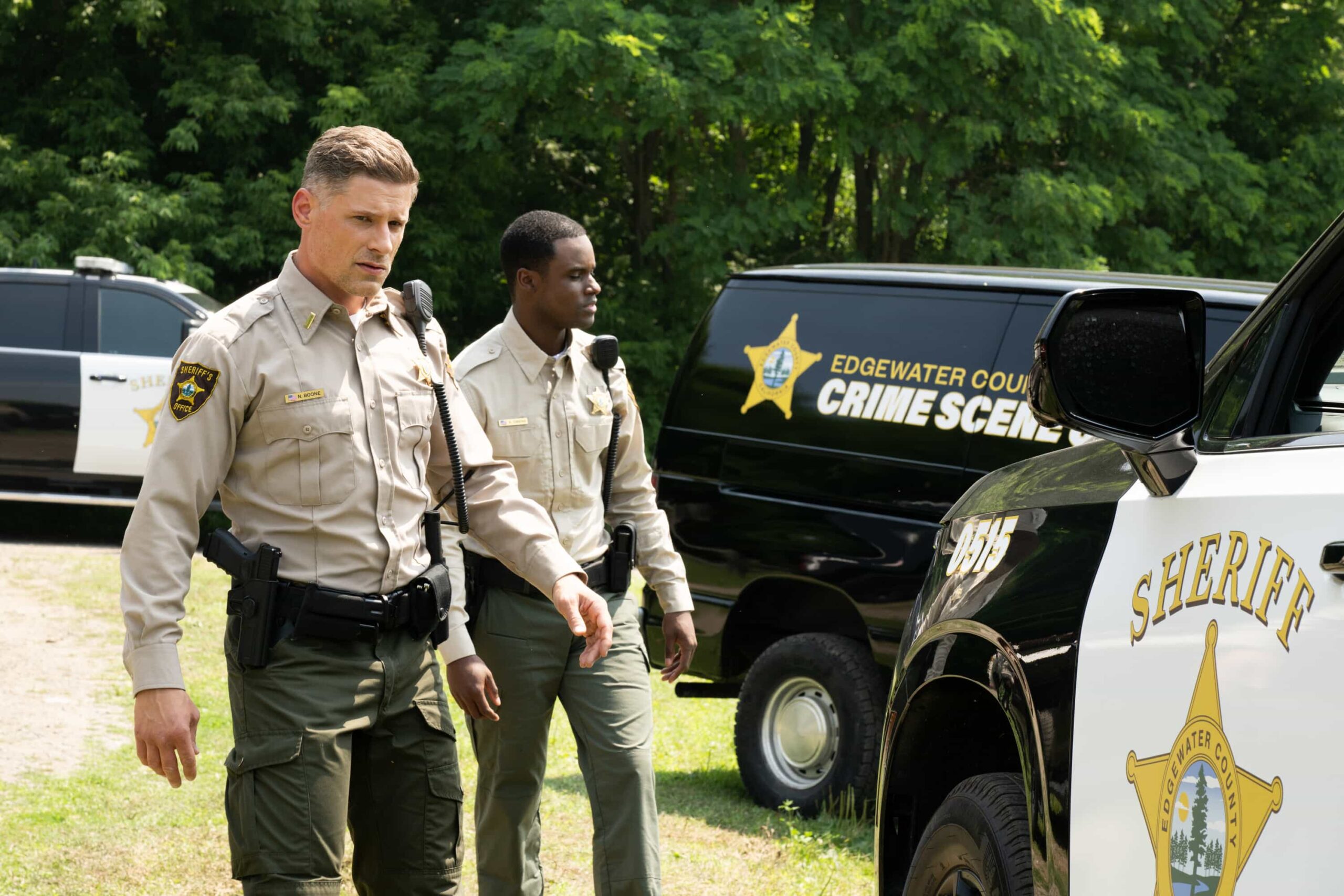 “Expecting Trouble” – A high-stakes transport mission puts Sheriff Mickey Fox and Deputy Boone on edge as they race against time to protect a vulnerable witness, on SHERIFF COUNTRY, Friday, Nov. 14 (8:00-9:00 PM, ET/PT) on the CBS Television Network, and streaming on Paramount+ (live and on-demand for Paramount+ Premium plan subscribers, or on-demand for Paramount+ Essential subscribers the day after the episode airs)*.  Pictured: Matt Lauria as Boone and Darnell Bartholomew as Deputy Cliff Owens. Photo: Christos Kalohoridis/CBS ©2025 CBS Broadcasting, Inc. All Rights Reserved.