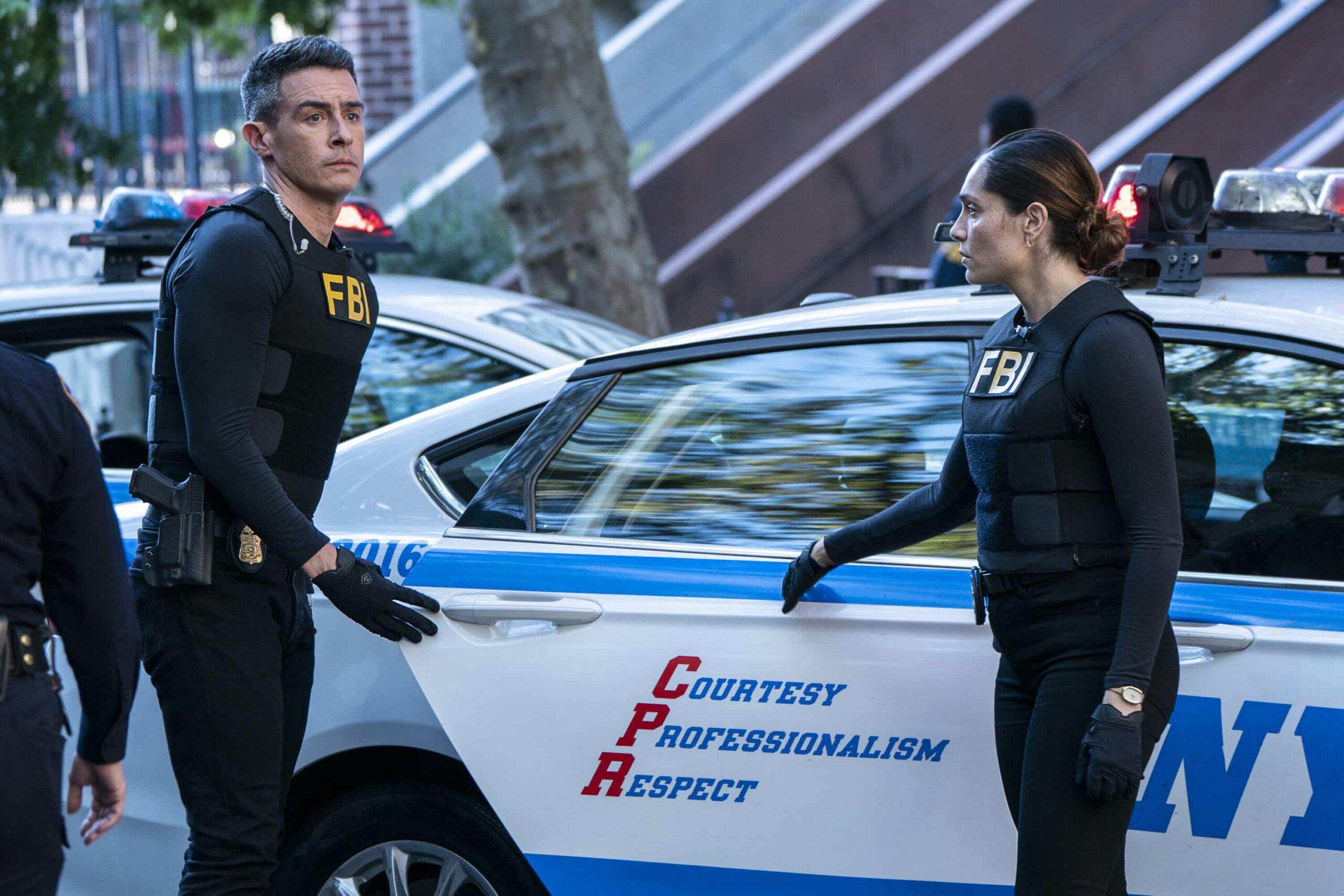 “Parental” – When a robbery at a community clinic turns deadly, the team investigates a drug trafficking crew and soon uncovers that the clinic’s doctor may be more involved than they initially thought. Meanwhile, Isobel and her stepdaughter are at odds over a family issue, on FBI, Monday, Nov. 17 (9:00-10:00 PM ET/PT) on the CBS Television Network, and streaming on Paramount+ (live and on-demand for Paramount+ Premium plan subscribers, or on-demand for Paramount+ Essential subscribers the day after the episode airs). Pictured (L-R): John Boyd as Special Agent Stuart Scola and Juliana Aidén Martinez as Eva Ramos. Photo: Bennett Raglin/CBS ©2025 CBS Broadcasting, Inc. All Rights Reserved.