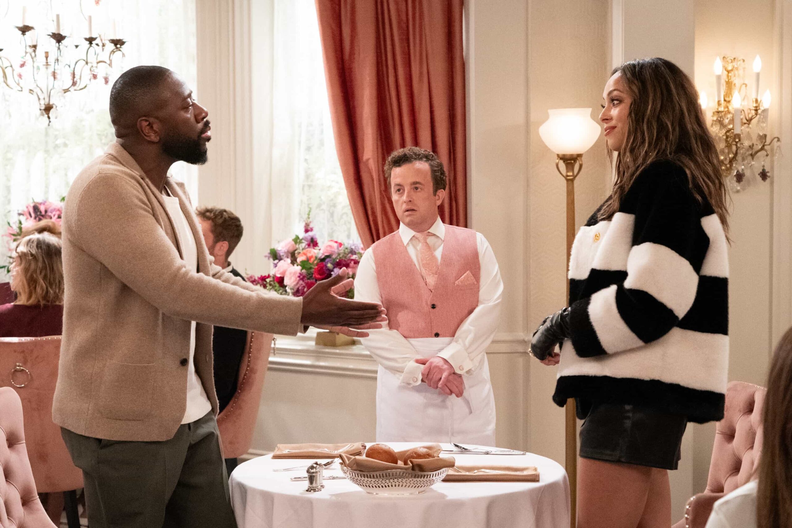 “Welcome to the Walk of Roses” – Calvin receives an unexpected honor that sparks mixed emotions, while Malcolm’s ghostwriting gig takes a wild turn after a viral outburst from his celebrity client, on THE NEIGHBORHOOD, Monday, Nov. 17 (8:00-8:30 PM, ET/PT) on the CBS Television Network, and streaming on Paramount+ (live and on-demand for Paramount+ Premium plan subscribers, or on-demand for Paramount+ Essential subscribers the day after the episode airs)*. Pictured: Sheaun McKinney as Malcolm, Rory Keane as Bernard and Amber West as Mercedes. Photo: Monty Brinton/CBS ©2025 CBS Broadcasting, Inc. All Rights Reserved.