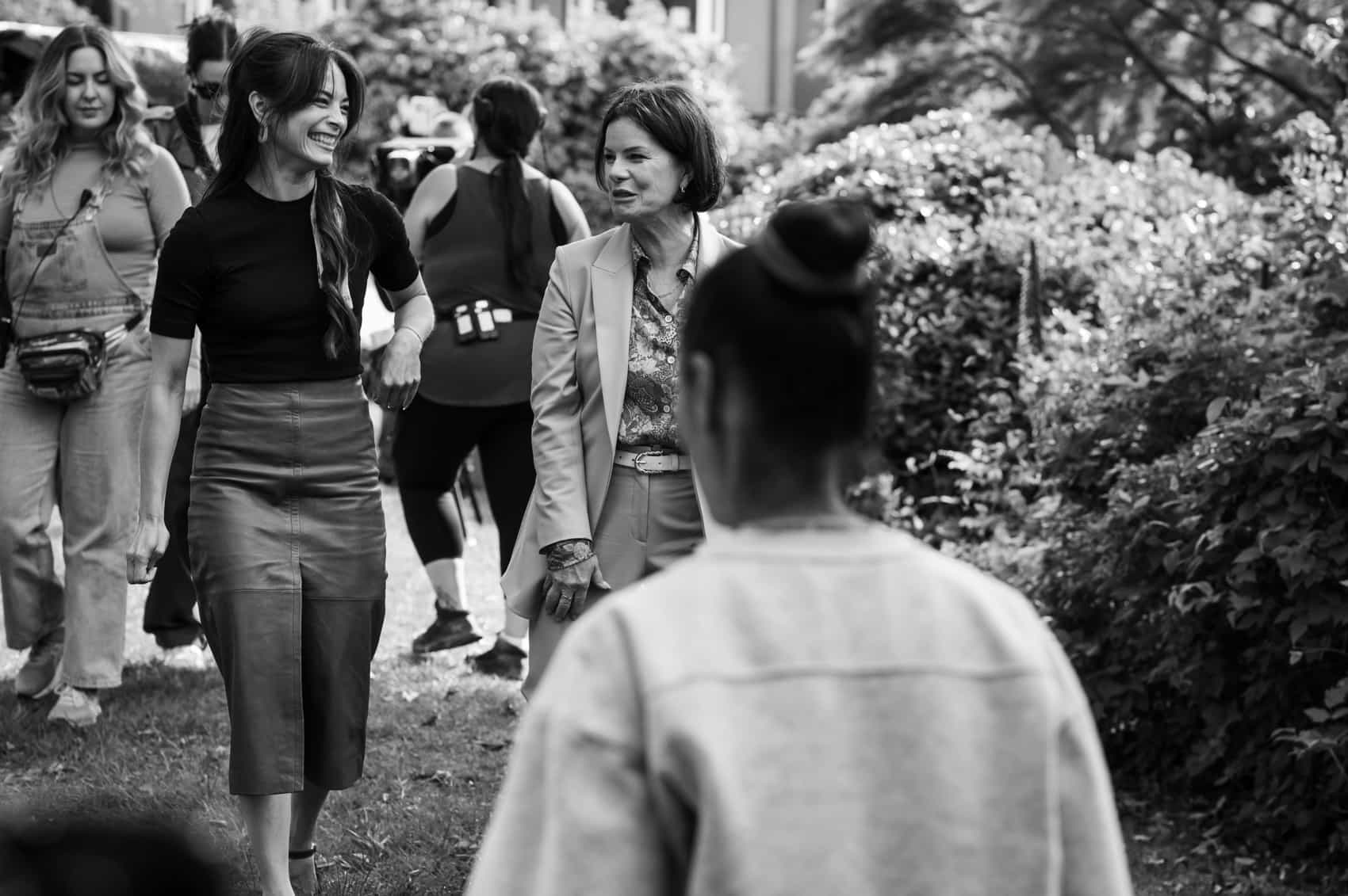 MURDER IN A SMALL TOWN: BEHIND THE SCENES: L-R: Kristin Kreuk and Marcia Gay Harden behind the scenes in the "Masterpiece" episode of MURDER IN A SMALL TOWN airing Tuesday, Nov. 18 (8:00-9:00PM ET/PT) on FOX. ©2025 Fox Media LLC. CR: Kailey Schwerman/ FOX.