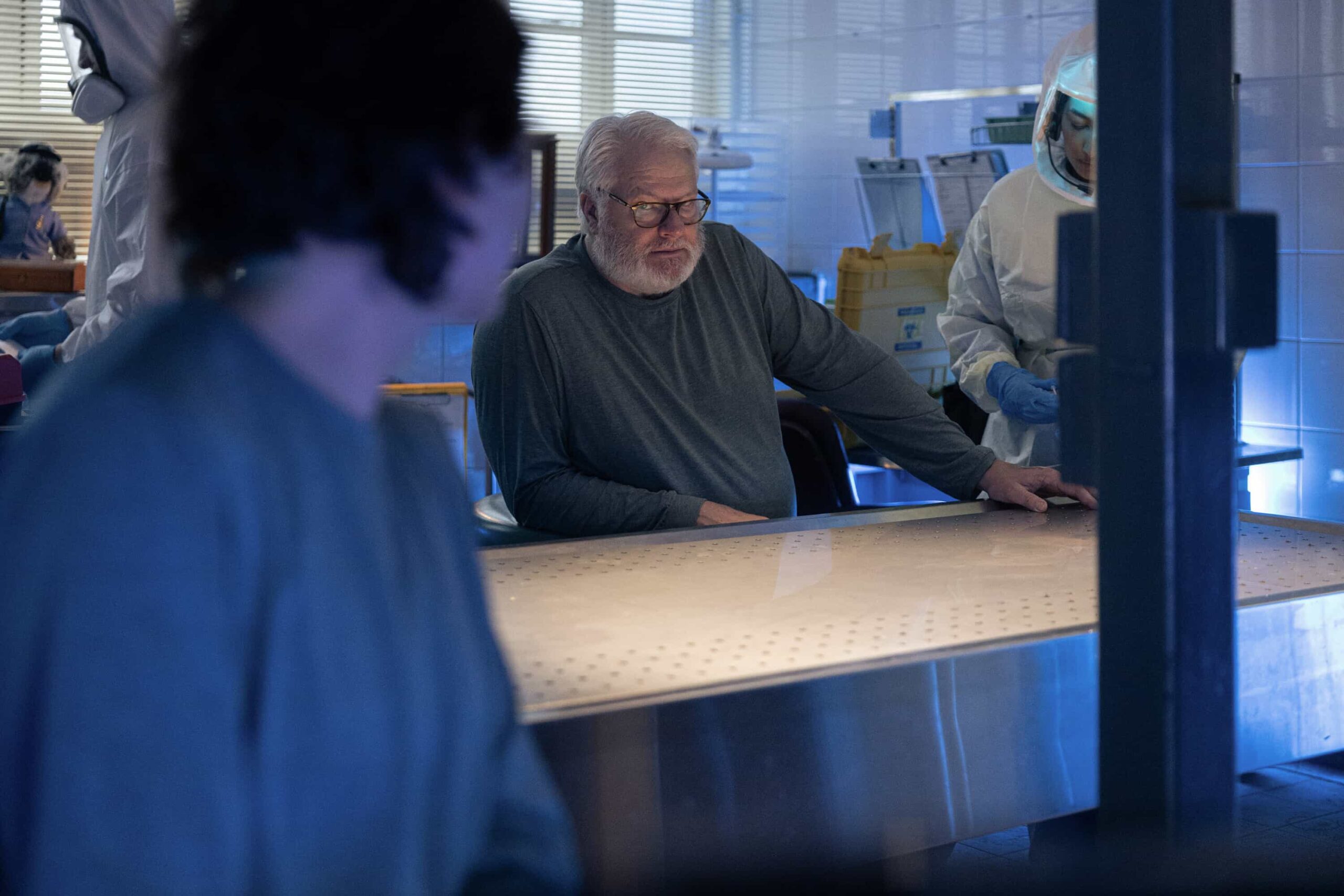 “Sucker Punch” – Confronted with Australia’s first case of Ebola, the team races to uncover how patient zero, a U.S. Navy scientist, contracted the deadly virus, only to have their search for answers complicated by a top-secret military research agency as two of their own fight for their lives, on NCIS: SYDNEY, Tuesday, Nov. 18 (10:00-11:00 PM, ET/PT) on the CBS Television Network, and streaming on Paramount+ (live and on demand for Paramount+ Premium plan subscribers, or on demand for Paramount+ Essential subscribers the day after the episode airs)*. Mavournee Hazel as Forensic Pathologist Bluebird \'Blue\' Gleeson and William McInnes as Forensic Pathologist Dr. Roy Penrose in NCIS: Sydney episode 6, season 3 streaming on Paramount+, 2025. Photo Credit:  Daniel Asher Smith/Paramount+   © TM & © 2025 CBS Studios Inc. NCIS: Sydney and related marks and logos  are trademarks of CBS Studios Inc. All Rights Reserved.