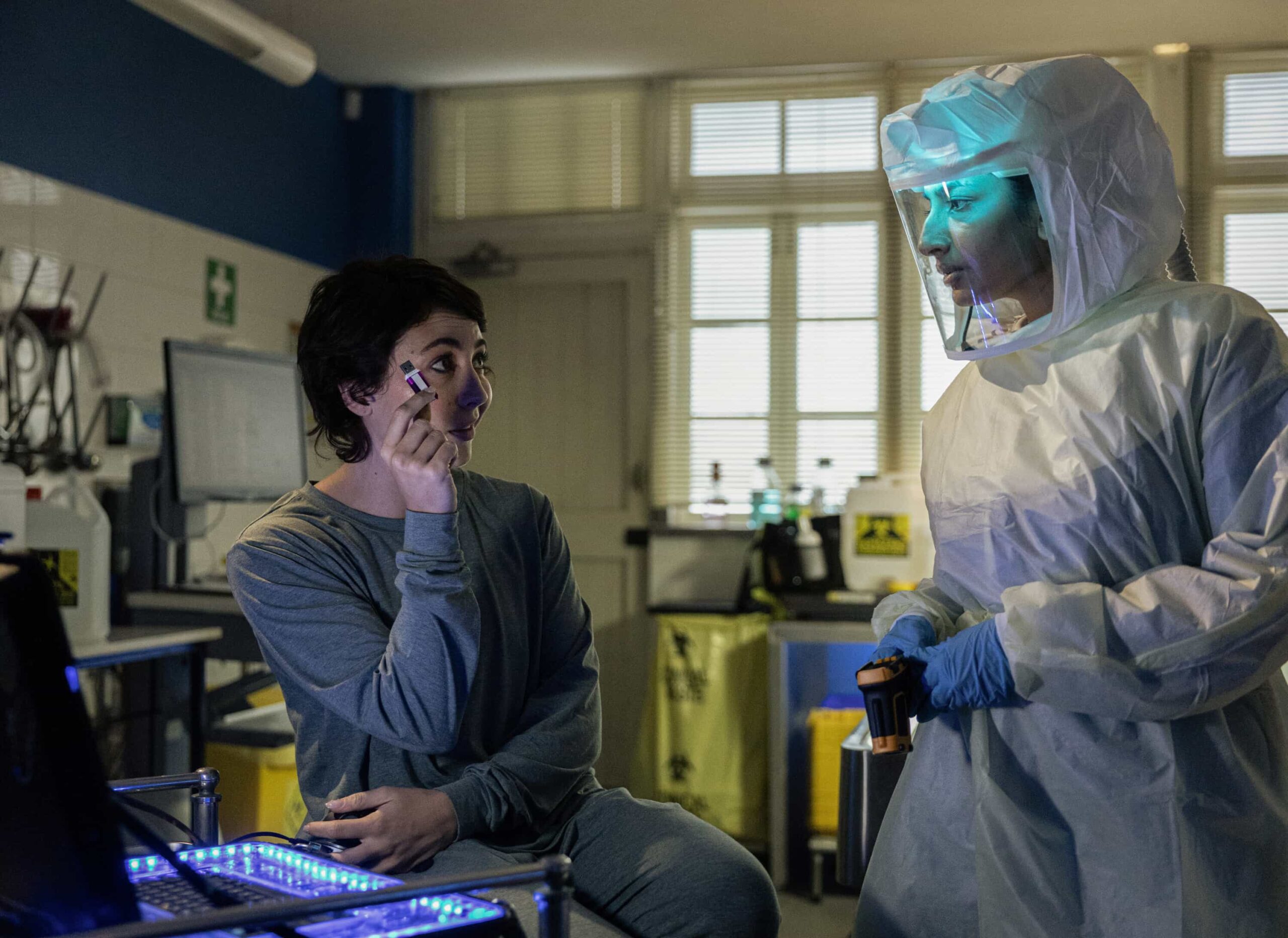 “Sucker Punch” – Confronted with Australia’s first case of Ebola, the team races to uncover how patient zero, a U.S. Navy scientist, contracted the deadly virus, only to have their search for answers complicated by a top-secret military research agency as two of their own fight for their lives, on NCIS: SYDNEY, Tuesday, Nov. 18 (10:00-11:00 PM, ET/PT) on the CBS Television Network, and streaming on Paramount+ (live and on demand for Paramount+ Premium plan subscribers, or on demand for Paramount+ Essential subscribers the day after the episode airs)*. Mavournee Hazel as Forensic Pathologist Bluebird \'Blue\' Gleeson and Monica Kumar as Cara Ashwin in NCIS: Sydney episode 6, season 3 streaming on Paramount+, 2025. Photo Credit:  Daniel Asher Smith/Paramount+   © TM & © 2025 CBS Studios Inc. NCIS: Sydney and related marks and logos  are trademarks of CBS Studios Inc. All Rights Reserved.