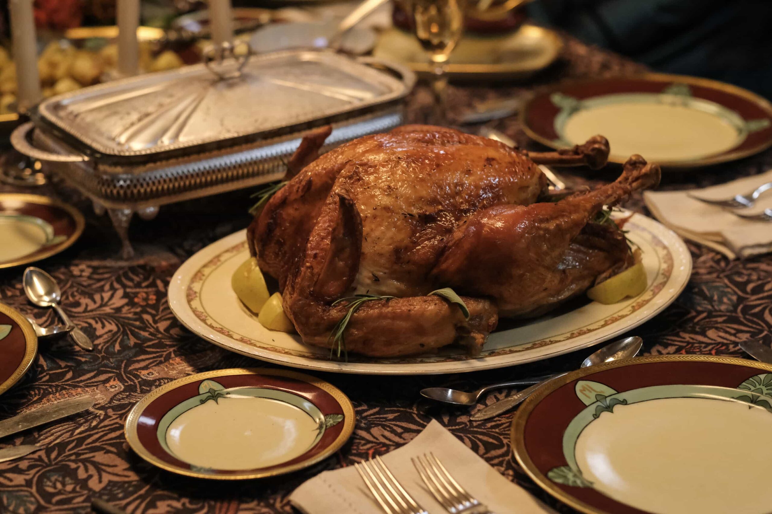 “Planes, Shanes and Automobiles” – Unsatisfied with Jay’s ability to tend to their needs while Sam is away, the ghosts bring in a better babysitter, Kyle. Meanwhile, Sam and Pete get on each other’s nerves during a book tour road trip, and things reach a breaking point when an airline strike threatens their ability to get home in time for Thanksgiving, on GHOSTS, Thursday, Nov. 20 (8:31-9:01 PM, ET/PT) on the CBS Television Network, and streaming on Paramount+ (live and on-demand for Paramount+ Premium plan subscribers, or on-demand for Paramount+ Essential subscribers the day after the episode airs)*.  Pictured (L-R): Turkey. Thanksgiving. Dinner. Plate. Plates.  Photo: Bertrand Calmeau/CBS ©2025 CBS Broadcasting, Inc. All Rights Reserved.