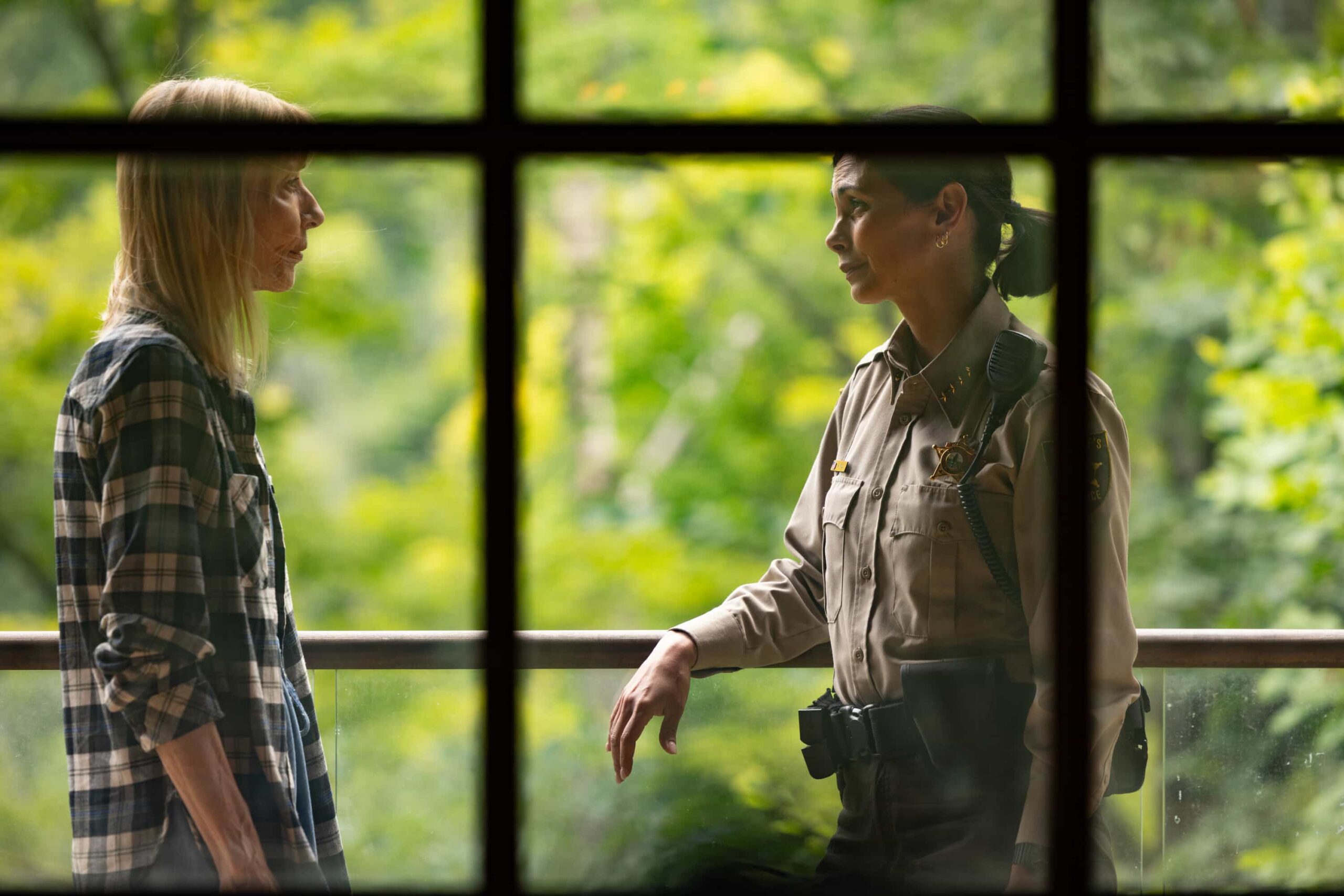 “Exit Interview” – When a body is discovered along the Eel River, Sheriff Mickey Fox and her team launch a homicide investigation that rattles the heart of Edgewater. Meanwhile, Wes risks everything to uncover the truth about the murder, on SHERIFF COUNTRY, Friday, Nov. 21 (8:00-9:00 PM, ET/PT) on the CBS Television Network, and streaming on Paramount+ (live and on-demand for Paramount+ Premium plan subscribers, or on-demand for Paramount+ Essential subscribers the day after the episode airs)*.  Pictured: Maria Ricossa as Bernice and Morena Baccarin as Sheriff Mickey Fox. Photo: Darren Goldstein/CBS ©2025 CBS Broadcasting, Inc. All Rights Reserved.