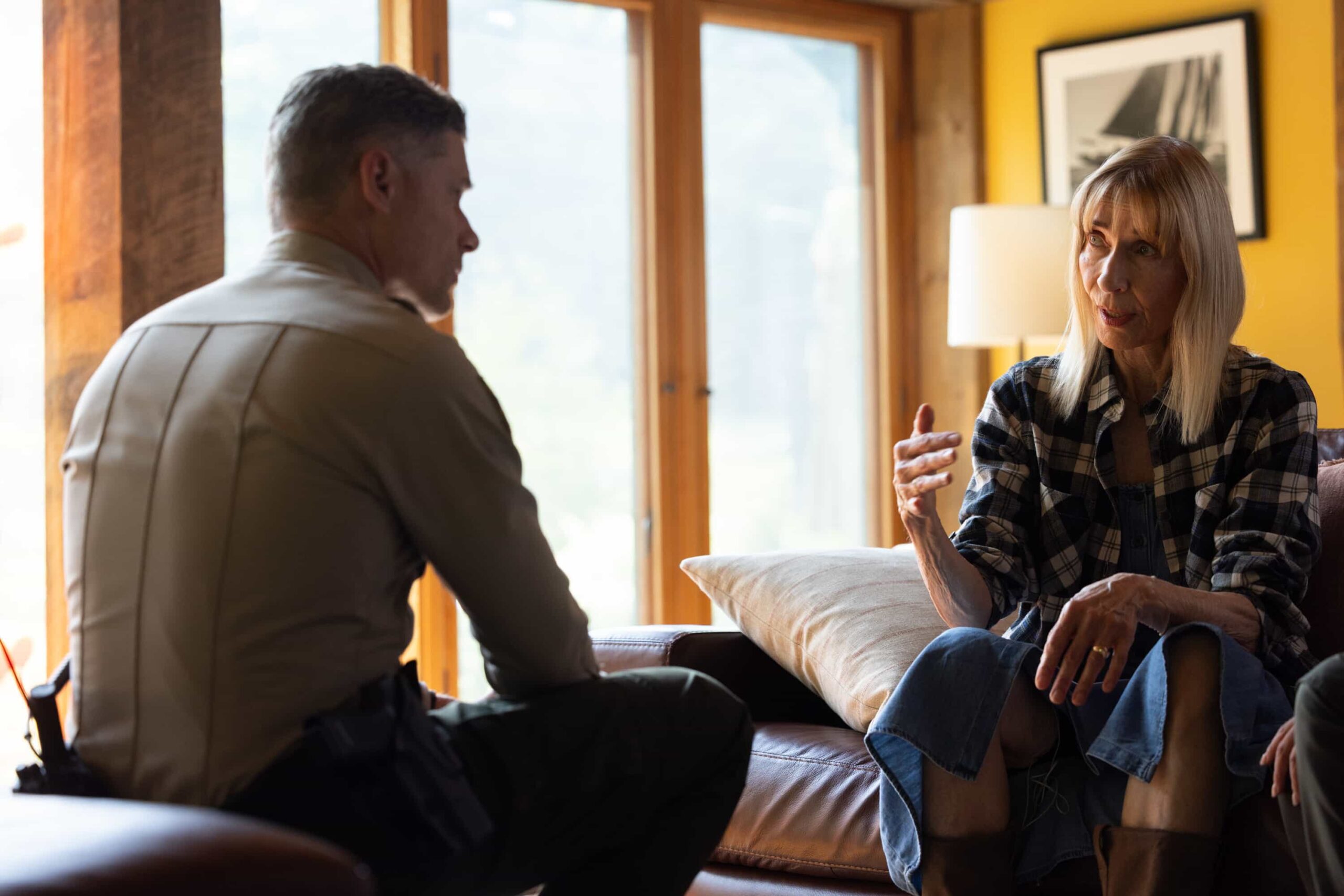 “Exit Interview” – When a body is discovered along the Eel River, Sheriff Mickey Fox and her team launch a homicide investigation that rattles the heart of Edgewater. Meanwhile, Wes risks everything to uncover the truth about the murder, on SHERIFF COUNTRY, Friday, Nov. 21 (8:00-9:00 PM, ET/PT) on the CBS Television Network, and streaming on Paramount+ (live and on-demand for Paramount+ Premium plan subscribers, or on-demand for Paramount+ Essential subscribers the day after the episode airs)*.  Pictured: Matt Lauria as Boone and Maria Ricossa as Bernice. Photo: Darren Goldstein/CBS ©2025 CBS Broadcasting, Inc. All Rights Reserved.