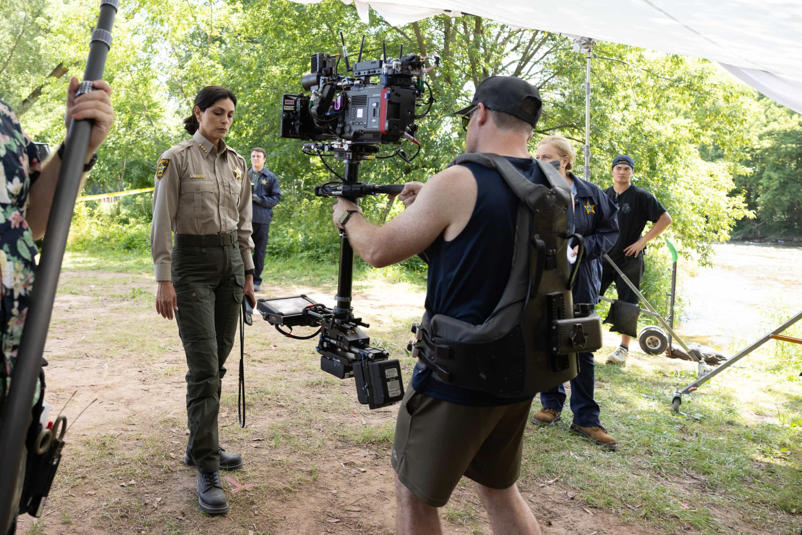 “Exit Interview” BTS – When a body is discovered along the Eel River, Sheriff Mickey Fox and her team launch a homicide investigation that rattles the heart of Edgewater. Meanwhile, Wes risks everything to uncover the truth about the murder, on SHERIFF COUNTRY, Friday, Nov. 21 (8:00-9:00 PM, ET/PT) on the CBS Television Network, and streaming on Paramount+ (live and on-demand for Paramount+ Premium plan subscribers, or on-demand for Paramount+ Essential subscribers the day after the episode airs)*.  Pictured: Morena Baccarin. Photo: Darren Goldstein/CBS ©2025 CBS Broadcasting, Inc. All Rights Reserved.