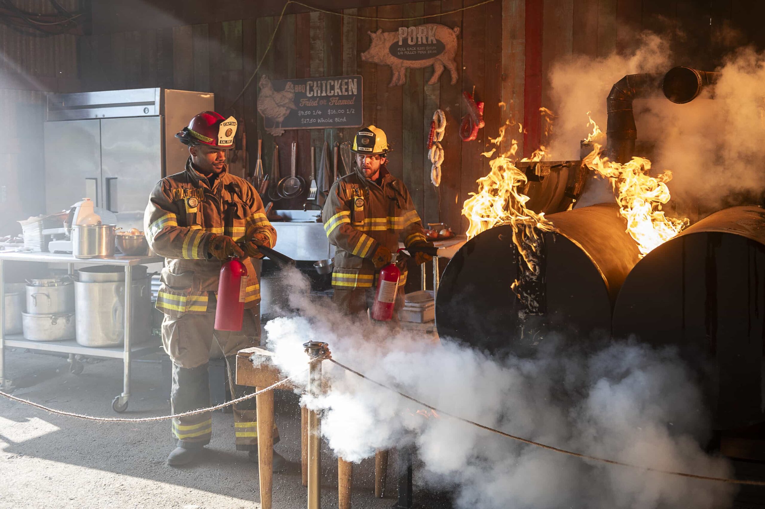 Fire Country Season 4 Episode 6 “Your Voice in My Head” – Station 42 responds to a dangerous fire at a beloved local smokehouse where Jake is forced to confront memories of his late father and the place they once shared, on FIRE COUNTRY, Friday, Nov. 21 (9:00-10:00 PM, ET/PT) on the CBS Television Network, and streaming on Paramount+ (live and on-demand for Paramount+ Premium plan subscribers, or on-demand for Paramount+ Essential subscribers the day after the episode airs). Pictured (L-R): Jordan Calloway as Jake Crawford and Max Thieriot as Bode Leone. Photo: Sergei Bachlakov/CBS ©2025 CBS Broadcasting, Inc. All Rights Reserved.