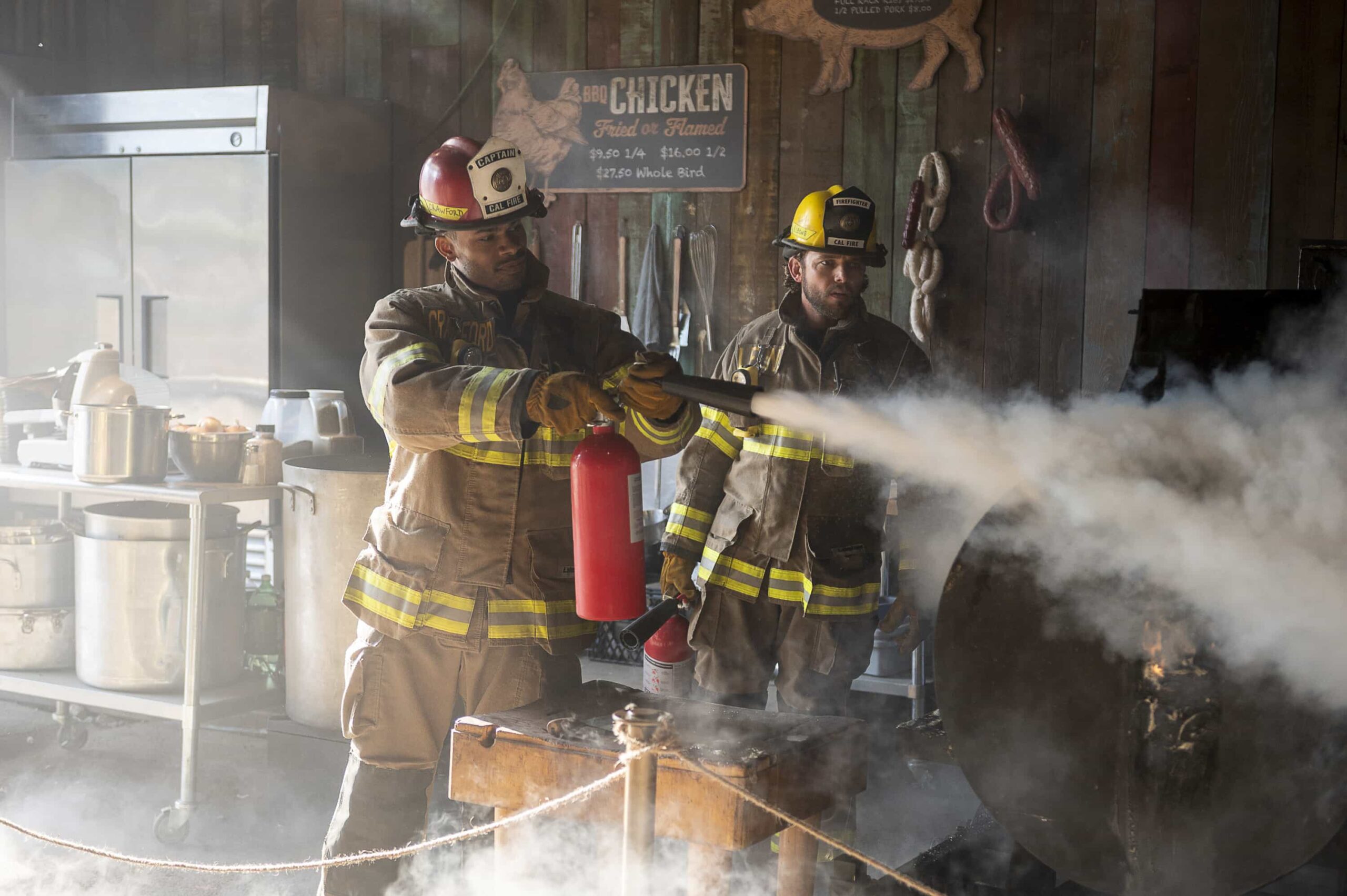 Fire Country Season 4 Episode 6 “Your Voice in My Head” – Station 42 responds to a dangerous fire at a beloved local smokehouse where Jake is forced to confront memories of his late father and the place they once shared, on FIRE COUNTRY, Friday, Nov. 21 (9:00-10:00 PM, ET/PT) on the CBS Television Network, and streaming on Paramount+ (live and on-demand for Paramount+ Premium plan subscribers, or on-demand for Paramount+ Essential subscribers the day after the episode airs).  Pictured (L-R): Jordan Calloway as Jake Crawford and Max Thieriot as Bode Leone. Photo: Sergei Bachlakov/CBS ©2025 CBS Broadcasting, Inc. All Rights Reserved.