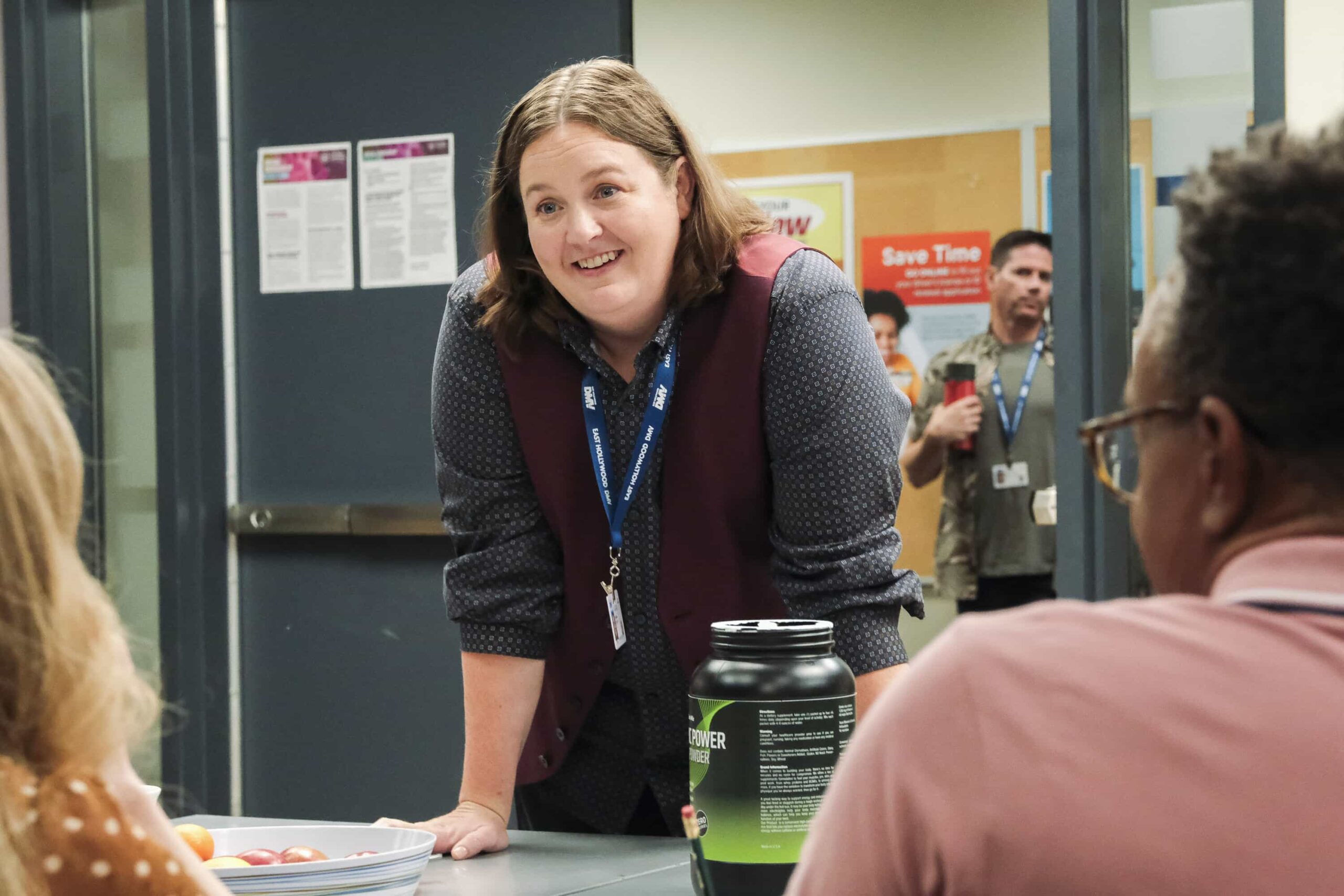 DMV Season 1 Episode 7  “There Is No I in DMV” – Barb takes the team on a field trip to the rival North Hollywood branch to learn the secrets of their success. She begins to doubt herself after meeting their charismatic manager, Beau (Randall Park). Meanwhile, Gregg and Vic get in Colette’s head that Noa prefers risk-takers, on DMV, Monday, Nov. 24 (9:30-10:00 PM, ET/PT) on the CBS Television Network, and streaming on Paramount+ (live and on-demand for Paramount+ Premium plan subscribers, or on-demand for Paramount+ Essential subscribers the day after the episode airs)*. Pictured: Molly Kearney as Barbara. Photo: Bertrand Calmeau/CBS ©2025 CBS Broadcasting, Inc. All Rights Reserved.