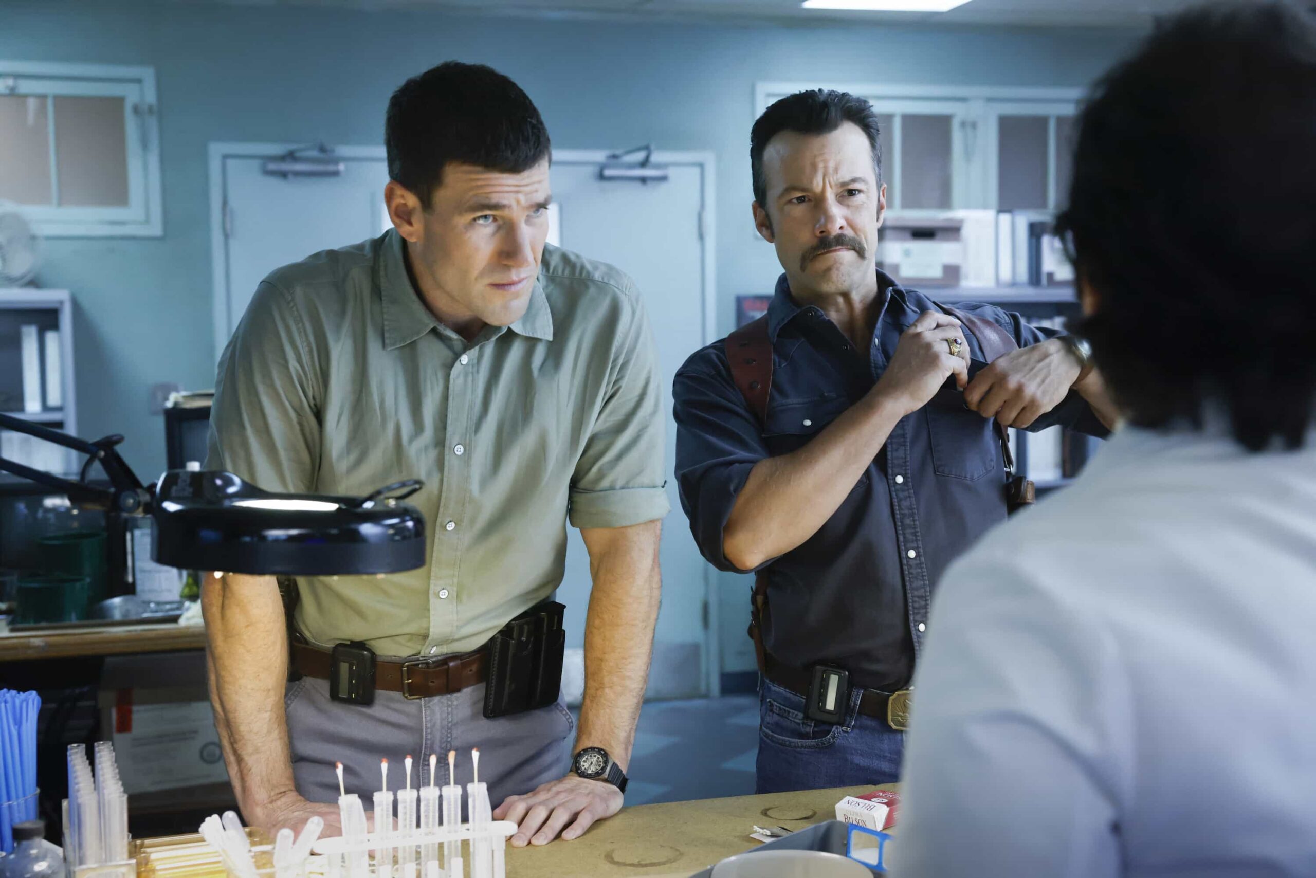 NCIS Origins Season 2 Episode 7  “Crazy Little Thing Called Love” – The team investigates the murder of a Marine who had recently been handpicked for a classified mission. Also, Wheeler’s personal life is upended, Lala is thrown by unexpected news from Vera, and Gibbs and Diane double-date with Randy and his wife, on NCIS: ORIGINS, Tuesday, Dec. 2 (9:00-10:00 PM, ET/PT) on the CBS Television Network, and streaming on Paramount+ (live and on demand for Paramount+ Premium plan subscribers, or on demand for Paramount+ Essential subscribers the day after the episode airs)*.  Pictured L to R: Austin Stowell as Leroy Jethro Gibbs and Kyle Schmid as Mike Franks.  Photo: Sonja Flemming/CBS ©2025 CBS Broadcasting, Inc. All Rights Reserved.