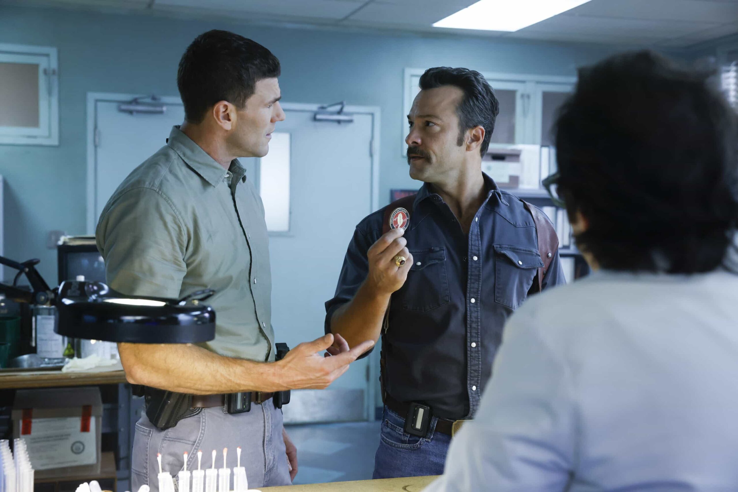 NCIS Origins Season 2 Episode 7  “Crazy Little Thing Called Love” – The team investigates the murder of a Marine who had recently been handpicked for a classified mission. Also, Wheeler’s personal life is upended, Lala is thrown by unexpected news from Vera, and Gibbs and Diane double-date with Randy and his wife, on NCIS: ORIGINS, Tuesday, Dec. 2 (9:00-10:00 PM, ET/PT) on the CBS Television Network, and streaming on Paramount+ (live and on demand for Paramount+ Premium plan subscribers, or on demand for Paramount+ Essential subscribers the day after the episode airs)*.  Pictured L to R: Austin Stowell as Leroy Jethro Gibbs and Kyle Schmid as Mike Franks.  Photo: Sonja Flemming/CBS ©2025 CBS Broadcasting, Inc. All Rights Reserved.