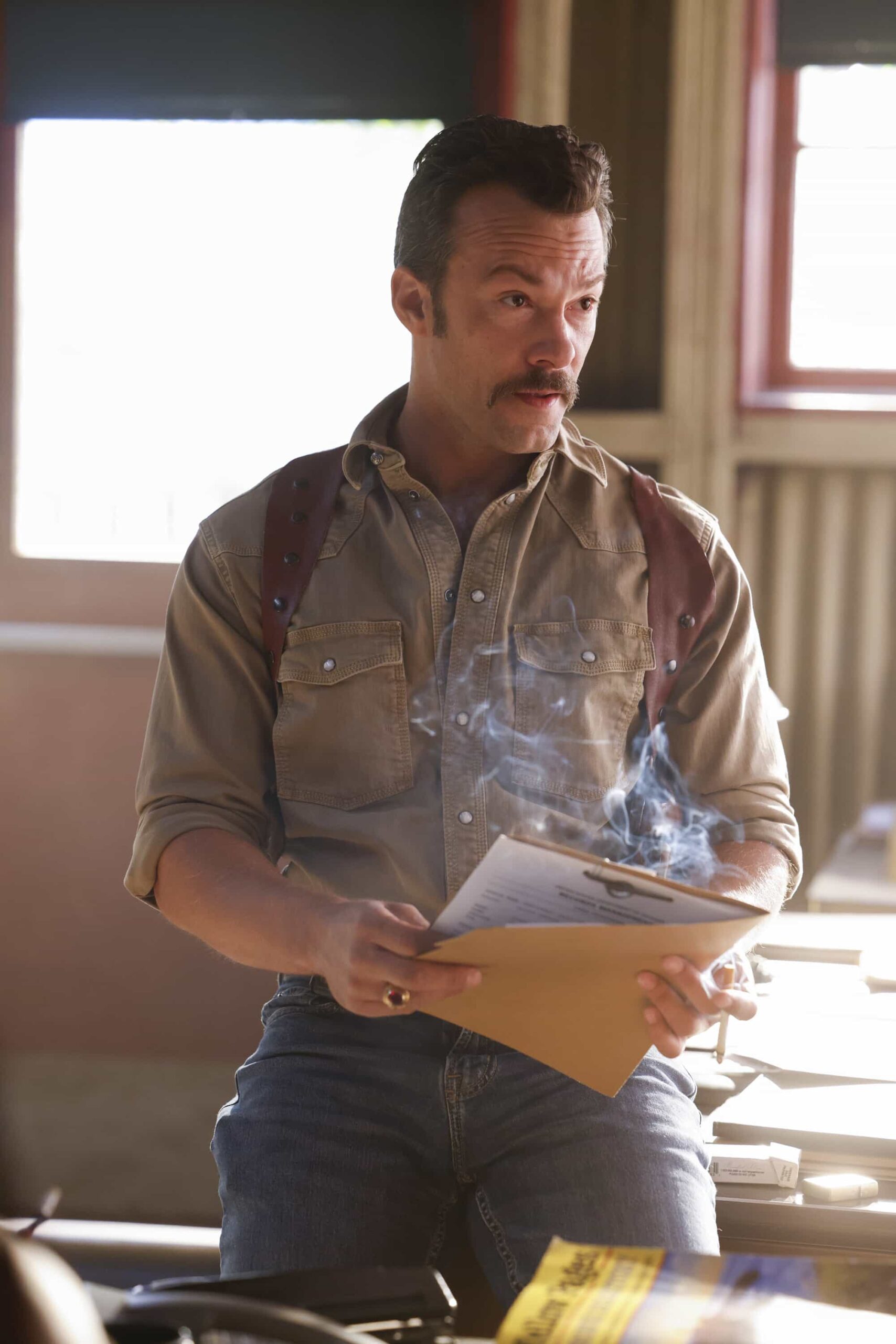 NCIS Origins Season 2 Episode 7  “Crazy Little Thing Called Love” – The team investigates the murder of a Marine who had recently been handpicked for a classified mission. Also, Wheeler’s personal life is upended, Lala is thrown by unexpected news from Vera, and Gibbs and Diane double-date with Randy and his wife, on NCIS: ORIGINS, Tuesday, Dec. 2 (9:00-10:00 PM, ET/PT) on the CBS Television Network, and streaming on Paramount+ (live and on demand for Paramount+ Premium plan subscribers, or on demand for Paramount+ Essential subscribers the day after the episode airs)*.  Pictured: Kyle Schmid as Mike Franks.  Photo: Sonja Flemming/CBS ©2025 CBS Broadcasting, Inc. All Rights Reserved.