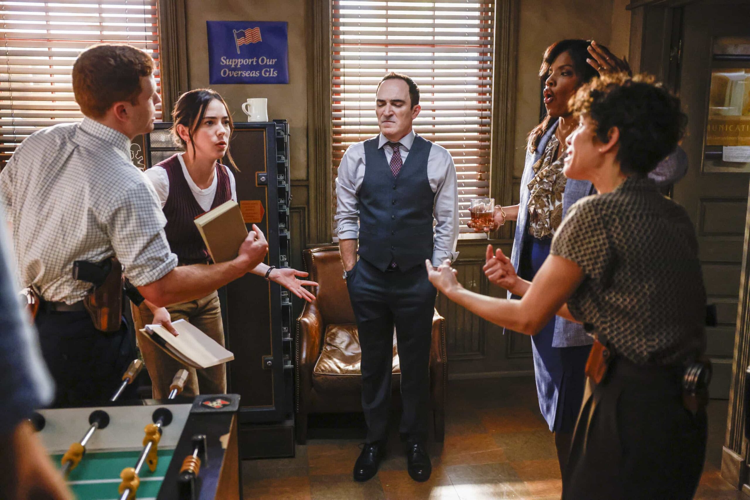 “Crazy Little Thing Called Love” – The team investigates the murder of a Marine who had recently been handpicked for a classified mission. Also, Wheeler’s personal life is upended, Lala is thrown by unexpected news from Vera, and Gibbs and Diane double-date with Randy and his wife, on NCIS: ORIGINS, Tuesday, Dec. 2 (9:00-10:00 PM, ET/PT) on the CBS Television Network, and streaming on Paramount+ (live and on demand for Paramount+ Premium plan subscribers, or on demand for Paramount+ Essential subscribers the day after the episode airs)*.  Pictured L to R:  Caleb Foote as Bernard “Randy” Randolf, Mariel Molino as Cecilia “Lala” Dominguez, Patrick Fischler as Cliff Walker and Tyla Abercrumbie as Mary Jo Hayes and Diany Rodriguez as Vera Strickland.  Photo: Sonja Flemming/CBS ©2025 CBS Broadcasting, Inc. All Rights Reserved.