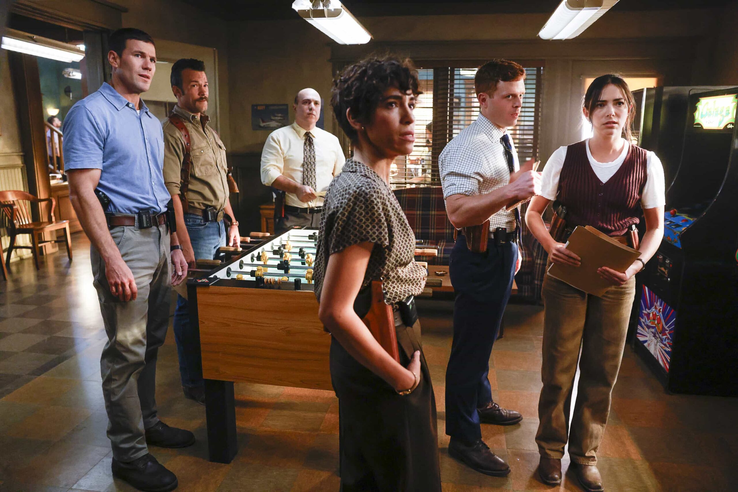 “Crazy Little Thing Called Love” – The team investigates the murder of a Marine who had recently been handpicked for a classified mission. Also, Wheeler’s personal life is upended, Lala is thrown by unexpected news from Vera, and Gibbs and Diane double-date with Randy and his wife, on NCIS: ORIGINS, Tuesday, Dec. 2 (9:00-10:00 PM, ET/PT) on the CBS Television Network, and streaming on Paramount+ (live and on demand for Paramount+ Premium plan subscribers, or on demand for Paramount+ Essential subscribers the day after the episode airs)*.  Pictured L to R: Austin Stowell as Leroy Jethro Gibbs, Kyle Schmid as Mike Franks, Matthew Henderson as NIS Special Agent Carl Loughlin, Diany Rodriguez as Vera Strickland, Caleb Foote as Bernard “Randy” Randolf, and Mariel Molino as Cecilia “Lala” Dominguez.  Photo: Sonja Flemming/CBS ©2025 CBS Broadcasting, Inc. All Rights Reserved.