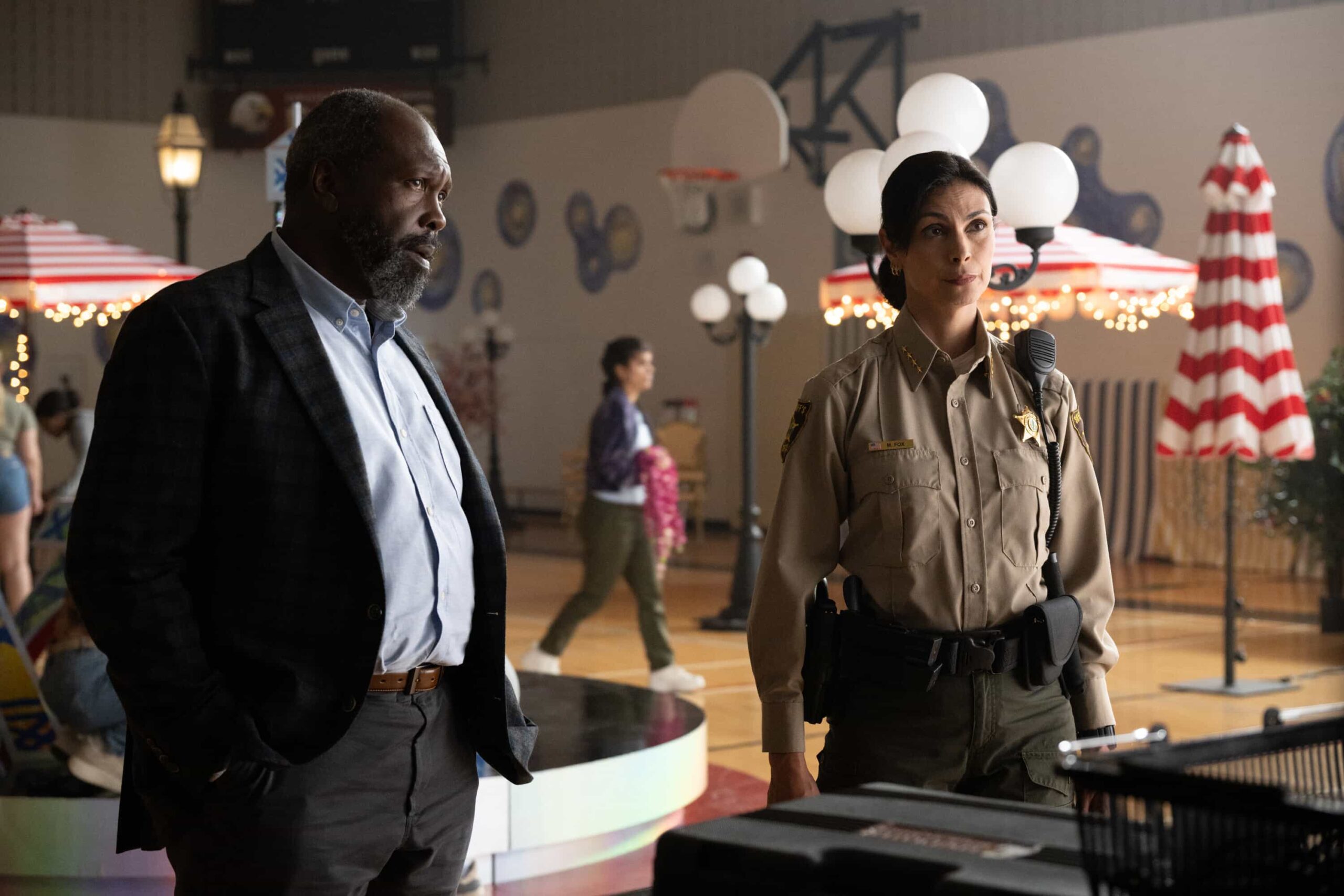“Glory Days” – While investigating a brutal assault at Edgewater High, Sheriff Mickey Fox uncovers a disturbing web of secrets, lies and abuse of power at the school, on SHERIFF COUNTRY, Friday, Dec. 5 (8:00-9:00 PM, ET/PT) on the CBS Television Network, and streaming on Paramount+ (live and on-demand for Paramount+ Premium plan subscribers, or on-demand for Paramount+ Essential subscribers the day after the episode airs)*. Pictured: Roy Lewis as Mr. Diamond and Morena Baccarin as Sheriff Mickey Fox. Photo: Christos Kalohoridis/CBS ©2025 CBS Broadcasting, Inc. All Rights Reserved.
