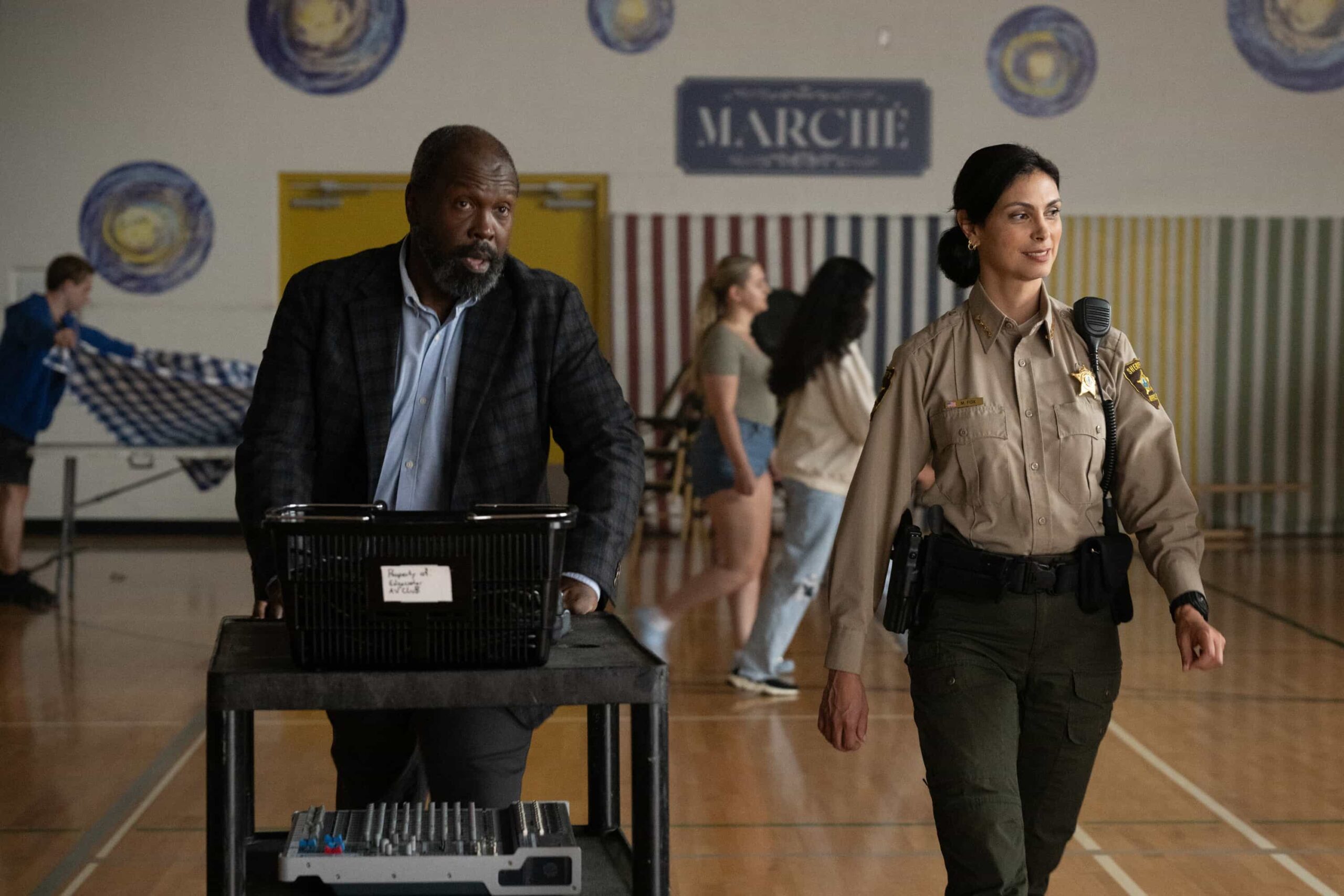 Sheriff Country Season 1 Episode 7 “Glory Days” – While investigating a brutal assault at Edgewater High, Sheriff Mickey Fox uncovers a disturbing web of secrets, lies and abuse of power at the school, on SHERIFF COUNTRY, Friday, Dec. 5 (8:00-9:00 PM, ET/PT) on the CBS Television Network, and streaming on Paramount+ (live and on-demand for Paramount+ Premium plan subscribers, or on-demand for Paramount+ Essential subscribers the day after the episode airs)*. Pictured: Roy Lewis as Mr. Diamond and Morena Baccarin as Sheriff Mickey Fox. Photo: Christos Kalohoridis/CBS ©2025 CBS Broadcasting, Inc. All Rights Reserved.