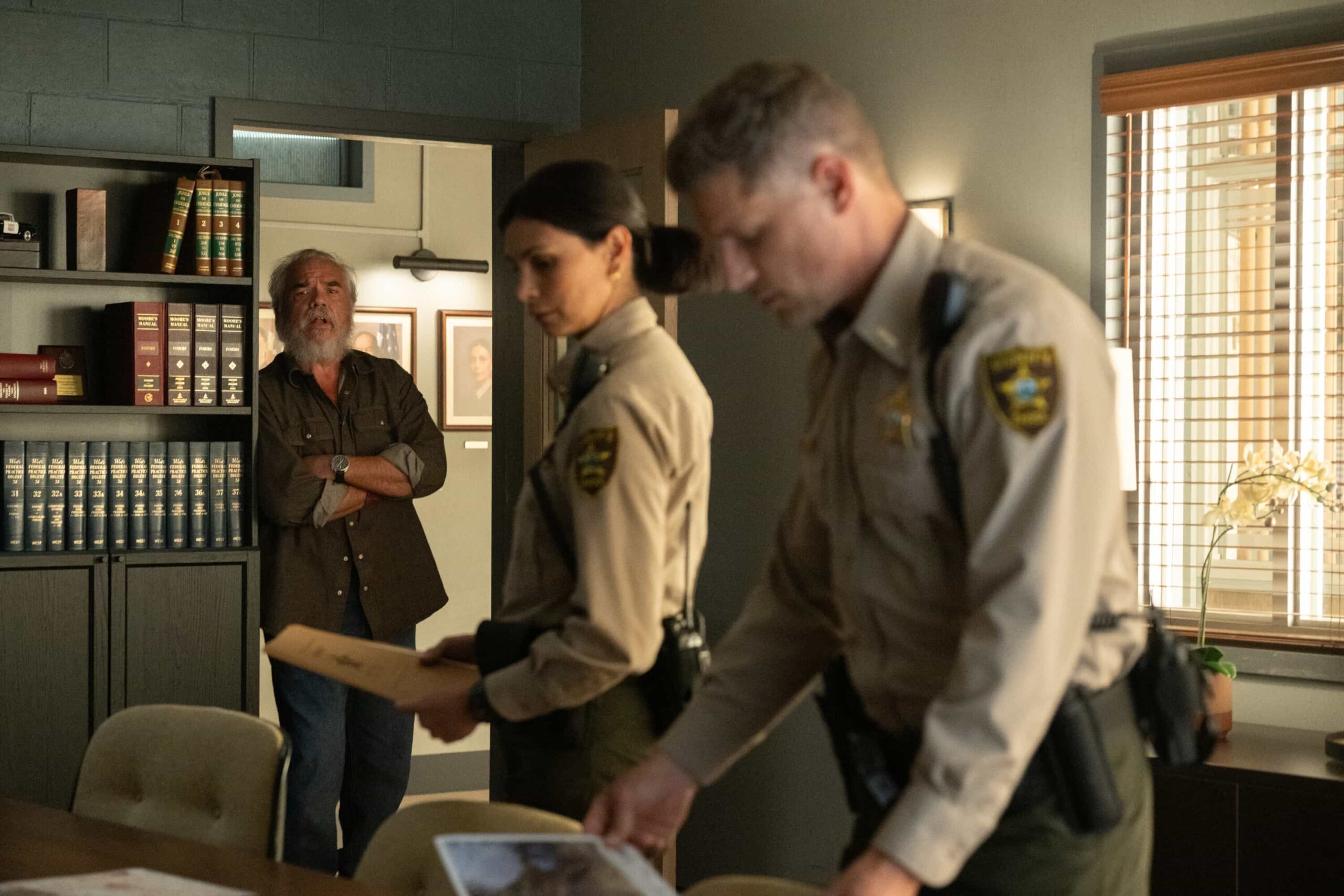 Sheriff Country Season 1 Episode 7 “Glory Days” – While investigating a brutal assault at Edgewater High, Sheriff Mickey Fox uncovers a disturbing web of secrets, lies and abuse of power at the school, on SHERIFF COUNTRY, Friday, Dec. 5 (8:00-9:00 PM, ET/PT) on the CBS Television Network, and streaming on Paramount+ (live and on-demand for Paramount+ Premium plan subscribers, or on-demand for Paramount+ Essential subscribers the day after the episode airs)*. Pictured: W. Earl Brown as Wes Fox, Morena Baccarin as Sheriff Mickey Fox and Matt Lauria as Boone. Photo: Christos Kalohoridis/CBS ©2025 CBS Broadcasting, Inc. All Rights Reserved.