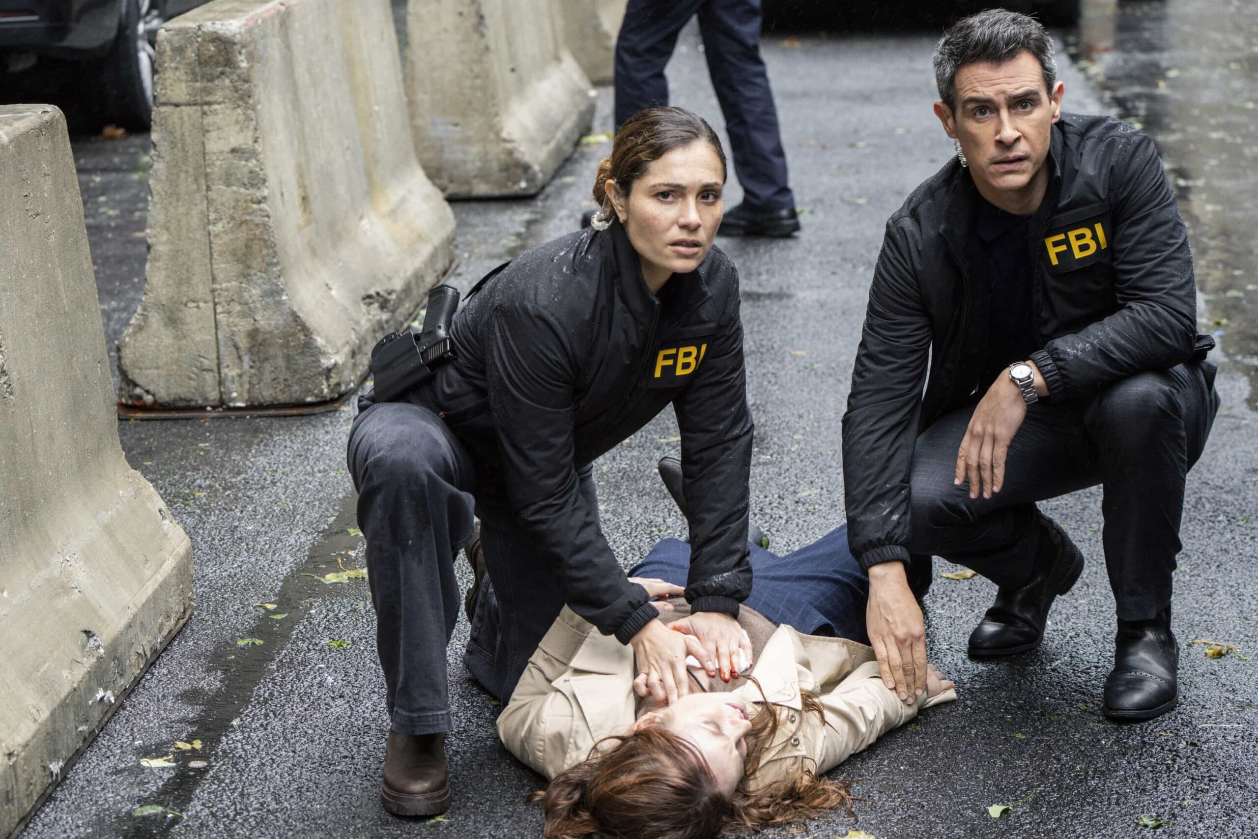 FBI Season 8 Episode 8 “Ratlined” – When a journalist is shot while interviewing a prime minister, all fingers point to an assassination attempt, but the team uncovers a deeper conspiracy after the assassin is also targeted. Meanwhile, OA struggles to let Gemma in on the dangers of his job, on FBI, Monday, Dec. 8 (9:00-10:00 PM, ET/PT) on the CBS Television Network, and streaming on Paramount+ (live and on-demand for Paramount+ Premium plan subscribers, or on-demand for Paramount+ Essential subscribers the day after the episode airs). Pictured (L-R): Juliana Aidén Martinez as Eva Ramos and John Boyd as Special Agent Stuart Scola. Photo: Bennett Raglin/CBS ©2025 CBS Broadcasting, Inc. All Rights Reserved.