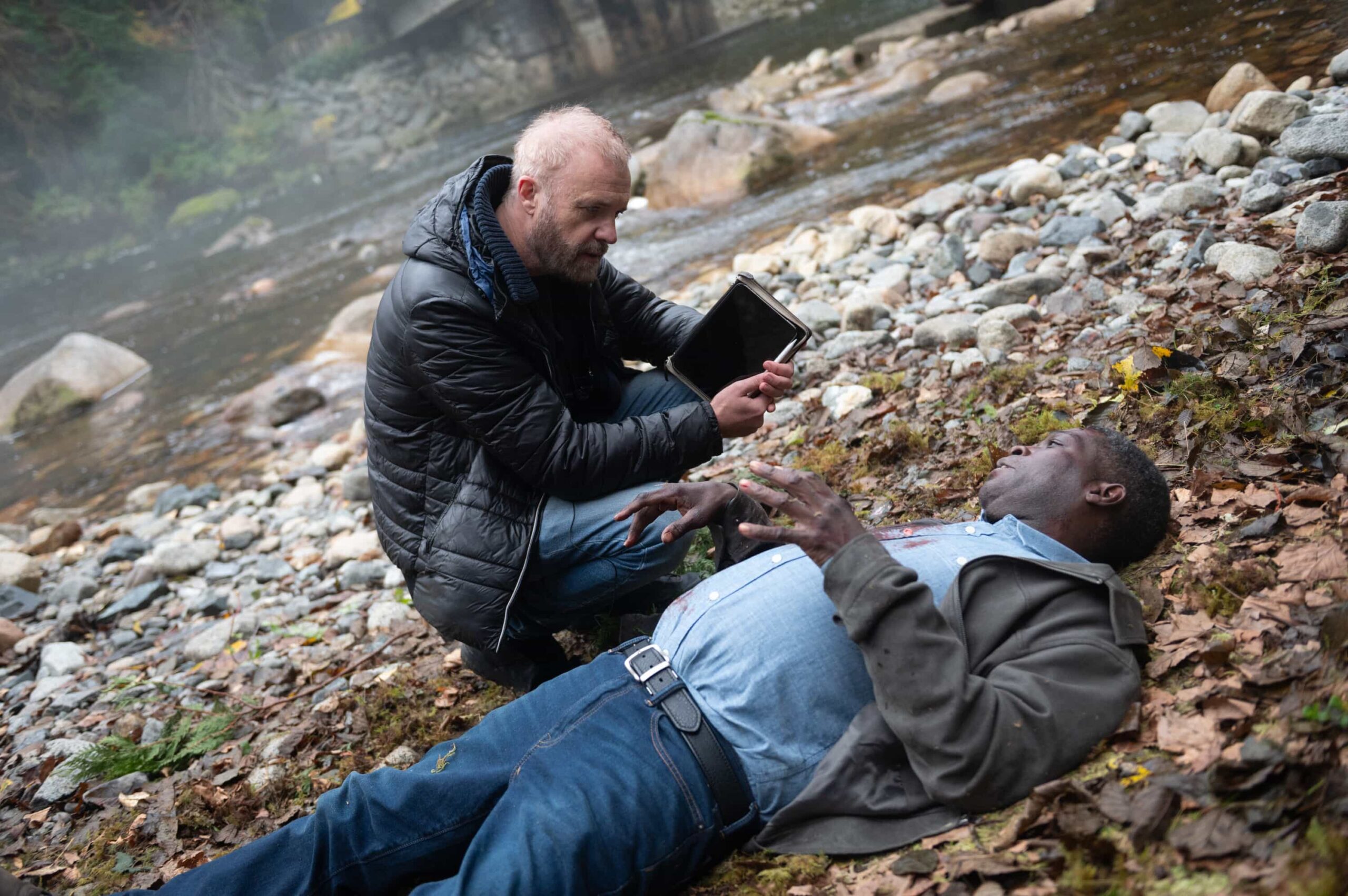 Tracker Season 3 Episode 9 “Good Trouble” – When Colter’s old friend Keaton asks for help finding his former partner, they uncover a trail of bodies and a conspiracy that runs deeper than they could’ve imagined, Sunday, Dec. 14 (8:30-9:30 PM, ET/8:00-9:00 PM, PT). Pictured: Director Jeff T. Thomas and Dean McKenzie. Photo: Sergei Bachlakov/CBS ©2025 CBS Broadcasting, Inc. All Rights Reserved.