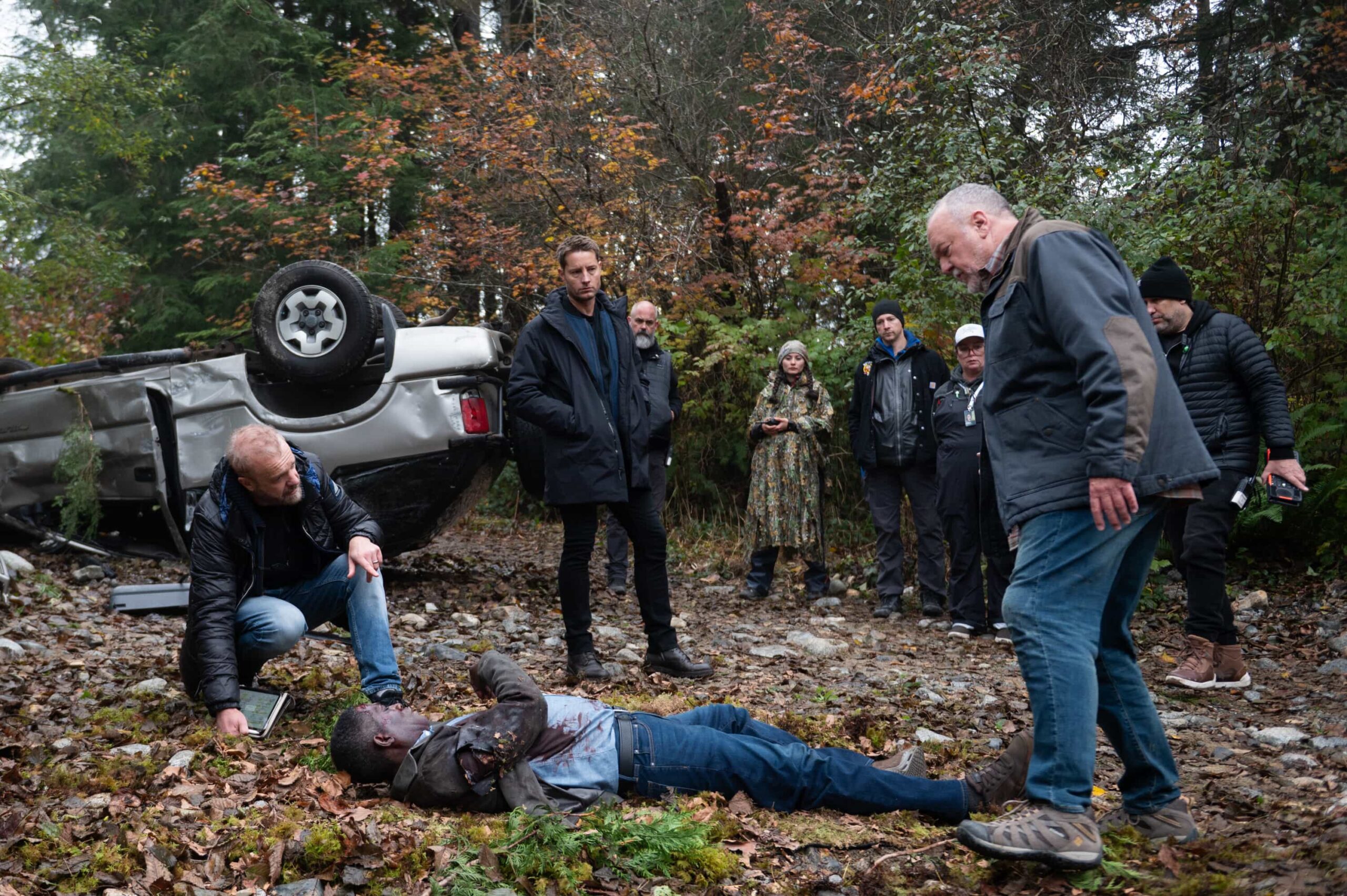 Tracker Season 3 Episode 9 “Good Trouble” – When Colter’s old friend Keaton asks for help finding his former partner, they uncover a trail of bodies and a conspiracy that runs deeper than they could’ve imagined, Sunday, Dec. 14 (8:30-9:30 PM, ET/8:00-9:00 PM, PT). Pictured: Director Jeff T. Thomas, Justin Hartley, Dean McKenzie and Brent Sexton. Photo: Sergei Bachlakov/CBS ©2025 CBS Broadcasting, Inc. All Rights Reserved.