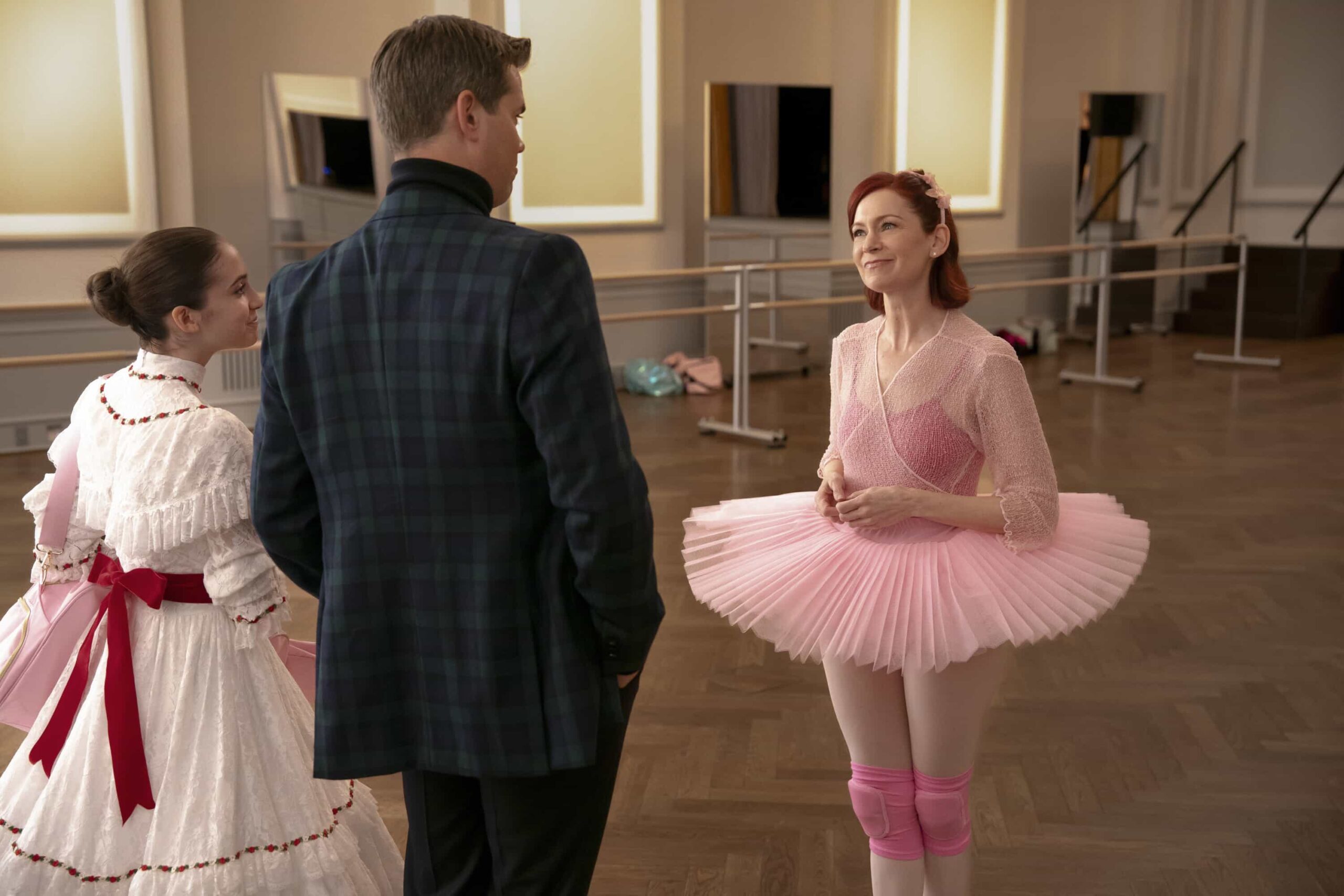 Elsbeth Season 3 Episode 10 “A Hard Nut to Crack” – When an avant-garde choreographer’s “Nutcracker” rehearsal turns deadly, Elsbeth leaps into the cutthroat world of New York ballet, on ELSBETH, Thursday, Dec. 18 (10:00-11:00 PM, ET/PT) .  Pictured (L-R): Willow McConnaughy as Noelle Bennett, Andrew Rannells as Harris Parson, and Carrie Preston as Elsbeth Tascioni in a ballet tutu   Photo: Michael Parmelee/CBS ©2025 CBS Broadcasting, Inc. All Rights Reserved.