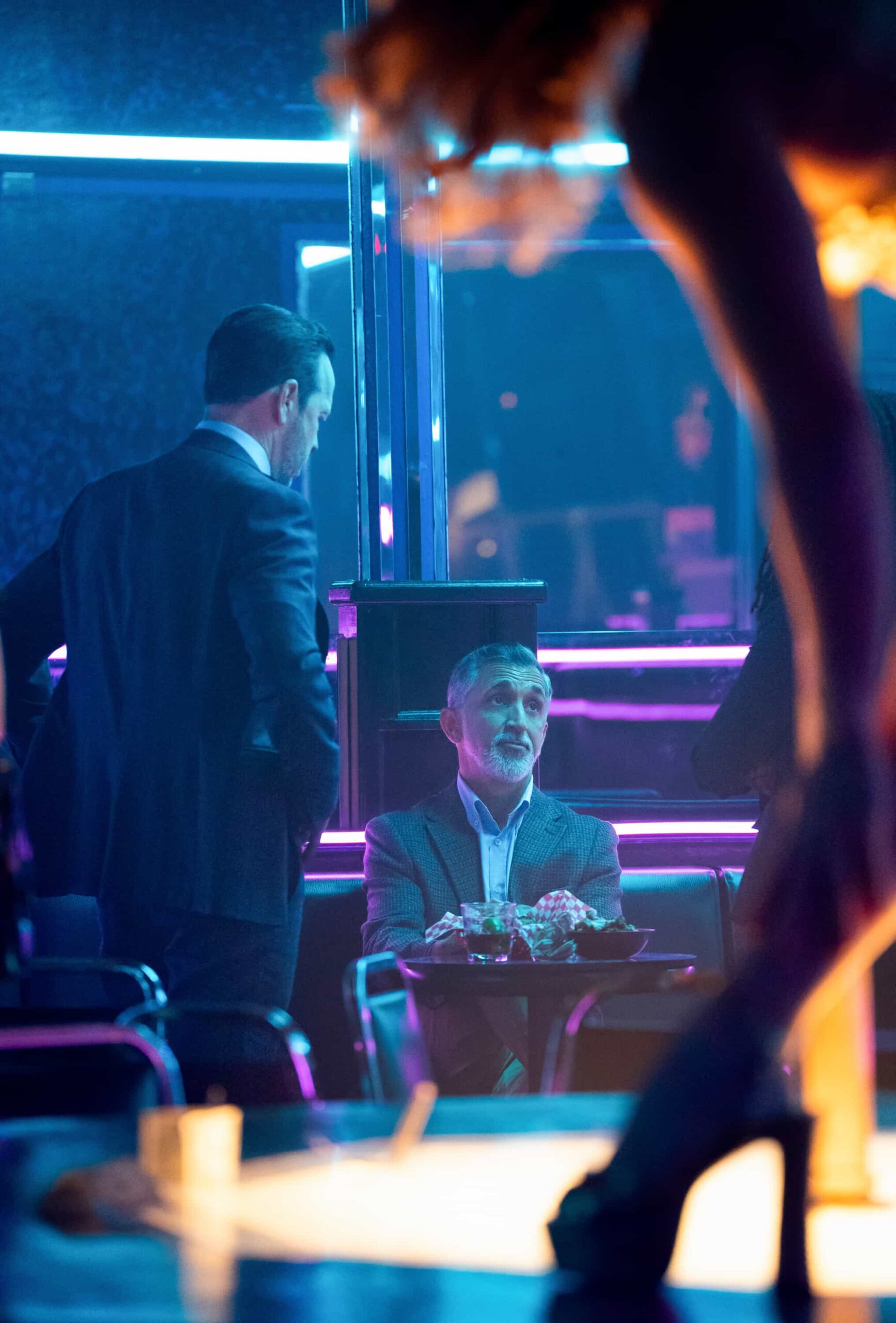 “Collateral Damage” – Mae faces public and family backlash over the consequences of her past decisions, while Sarah struggles with guilt that pushes her to take risks in pursuit of justice. At the same time, Lena and Danny dive into a tense homicide case, and Jonah’s anger over his father’s death threatens to unravel fragile family ties, on the CBS Original series BOSTON BLUE, Friday, Dec. 19   Pictured (L-R): Donnie Wahlberg as Danny Reagan and James Madio as Agent Stephen Owen  Photo: Brendan Adam-Zwelling/CBS ©2025 CBS Broadcasting, Inc. All Rights Reserved.