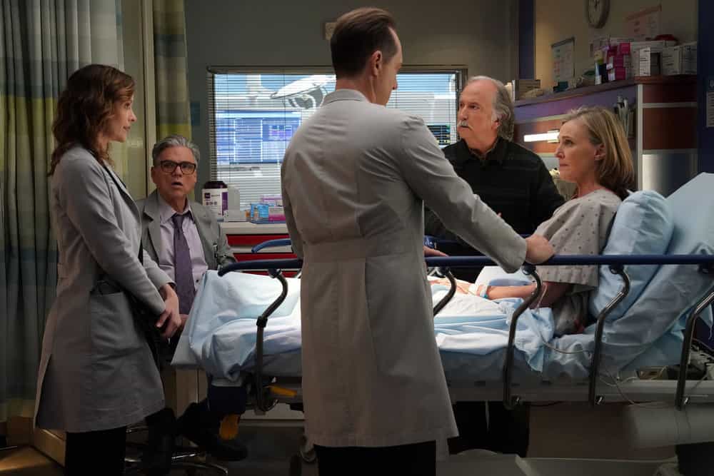 CHICAGO MED -- "Our So Called Lives" Episode 1111 -- Pictured: (l-r) Sarah Ramos as Dr. Caitlin Lenox, Oliver Platt as Dr. Daniel Charles, Mark Linn-Baker as Dr. Howie Mankiewicz, Brenda Strong as Dr. Suzie Mankiewicz -- (Photo by: Elizabeth Sisson/NBC)