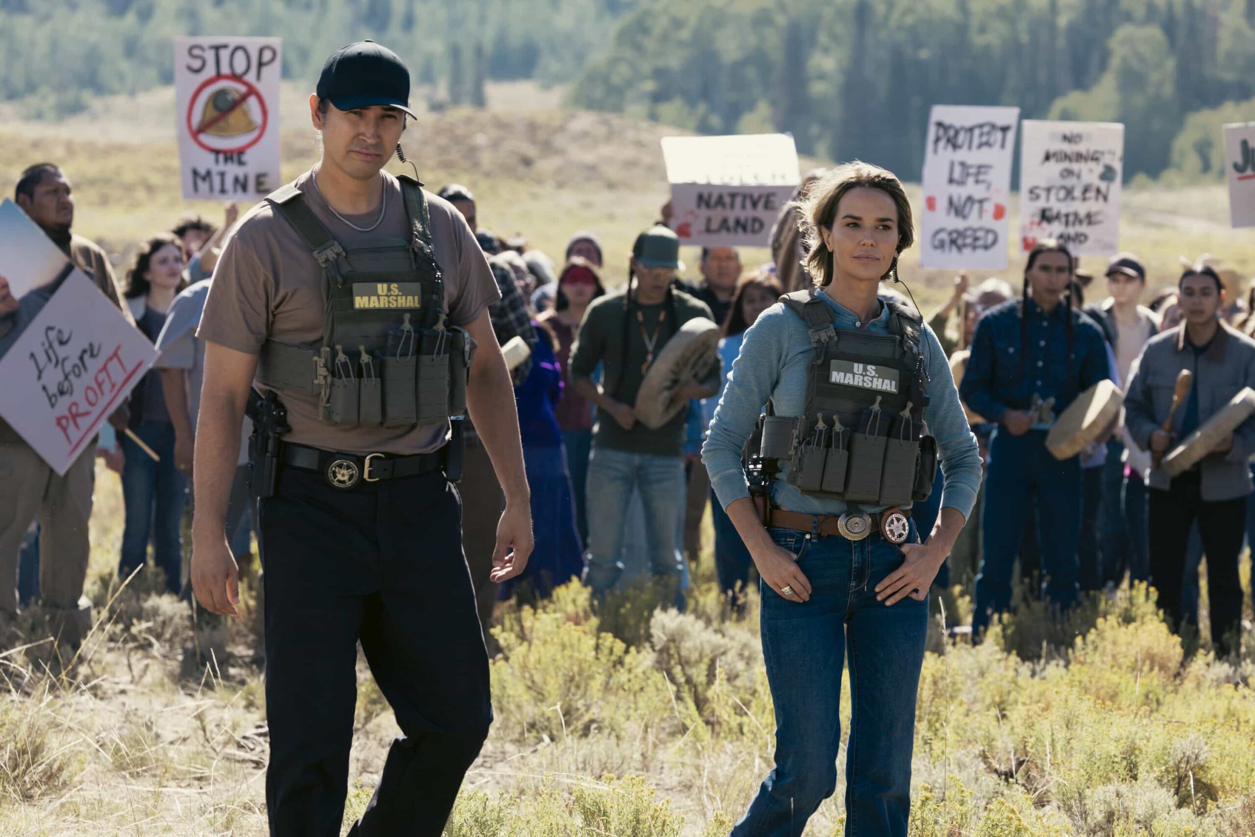 "Piya Wiconi" -- Kayce Dutton reunites with an old SEAL teammate and aids his Marshal unit in hunting down a bomber targeting Broken Rock Reservation. The trail leads to a dangerous encounter with an armed anti-government militia on the series premiere of MARSHALS, Sunday, March 1 (8:00-9:00 PM, ET/PT).  Pictured (L-R): Tatanka Means as Miles and Arielle Kebbel as Belle. Photo: Sonja Flemming/CBS ©2025 CBS Broadcasting, Inc. All Rights Reserved.