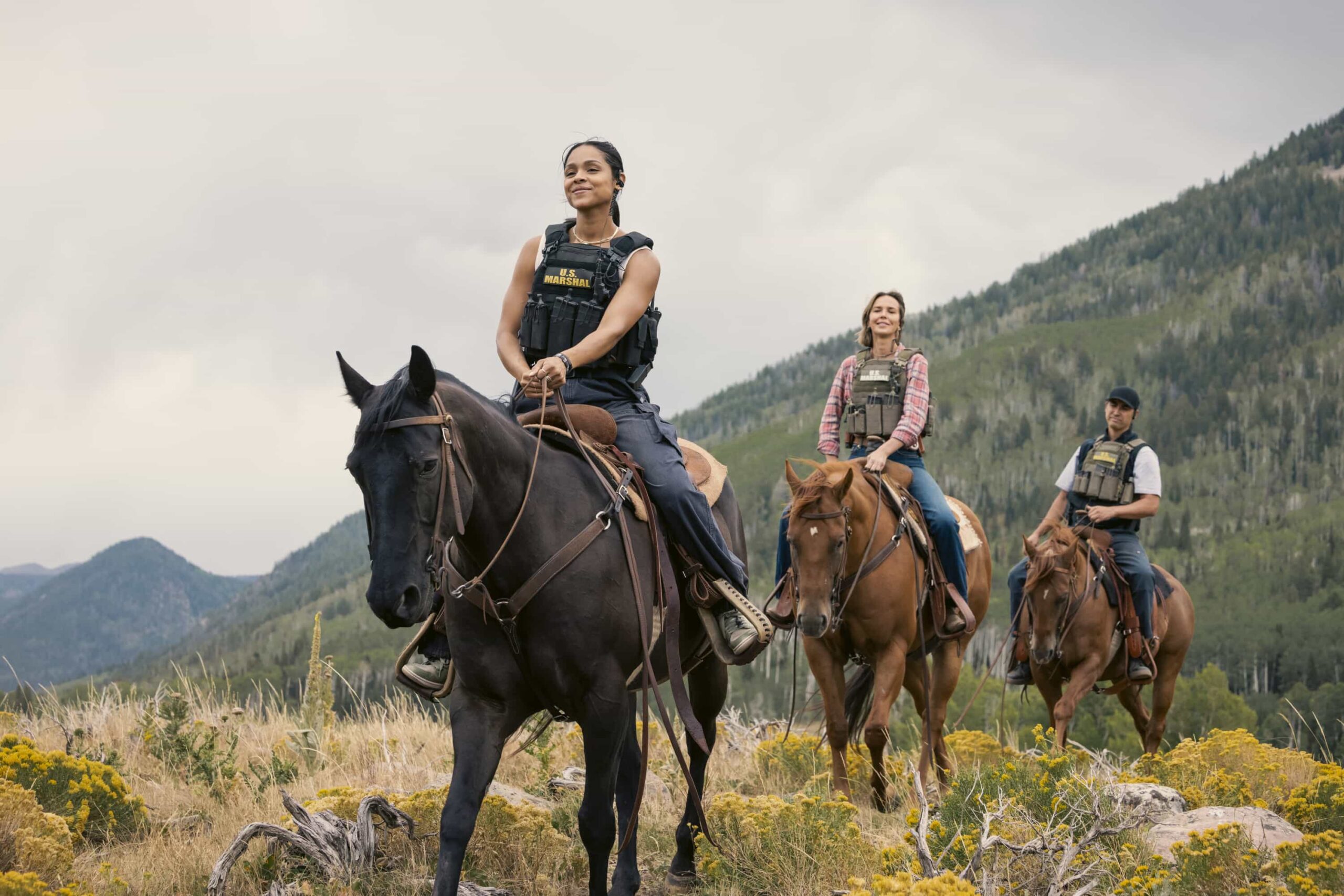 "Piya Wiconi" -- Kayce Dutton reunites with an old SEAL teammate and aids his Marshal unit in hunting down a bomber targeting Broken Rock Reservation. The trail leads to a dangerous encounter with an armed anti-government militia on the series premiere of MARSHALS, Sunday, March 1 (8:00-9:00 PM, ET/PT).  Pictured (L-R): Ash Santos as Andrea and Arielle Kebbel as Belle. Photo: Sonja Flemming/CBS ©2025 CBS Broadcasting, Inc. All Rights Reserved.