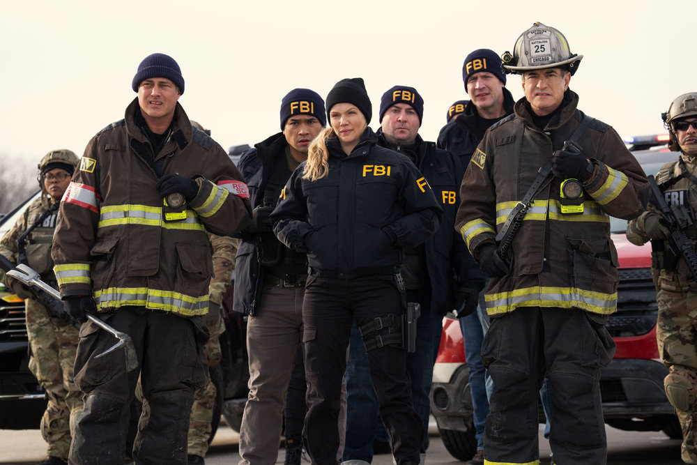 CHICAGO FIRE Season 14 Episode 13 Promo -- "Reckoning, Part 1" Episode 1413 -- Pictured: (l-r) Taylor Kinney as Kelly Severide, Tracy Spiridakos as Hailey Upton, Dermot Mulroney as Chief Dom Pascal -- (Photo by: Peter Gordon/NBC)