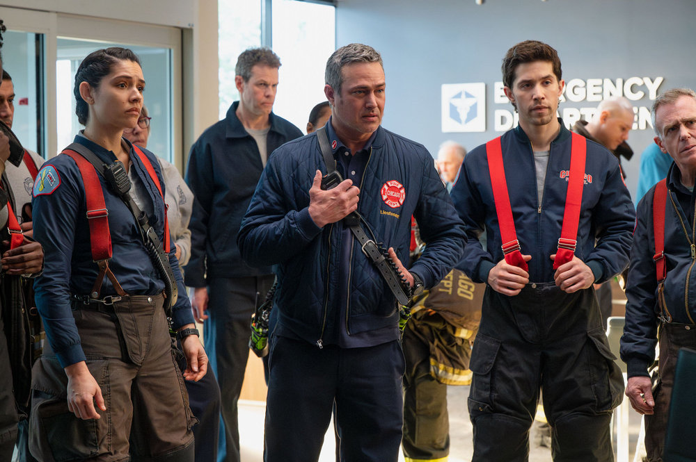 CHICAGO PD Season 13 Episode 13 Promo -- "Reckoning, Part 3" Episode 1313 -- Pictured: (l-r) Miranda Rae Mayo as Stella Kidd, Taylor Kinney as Kelly Severide, Brandon Larracuente as Sal Vasquez -- (Photo by: Lori Allen/NBC)