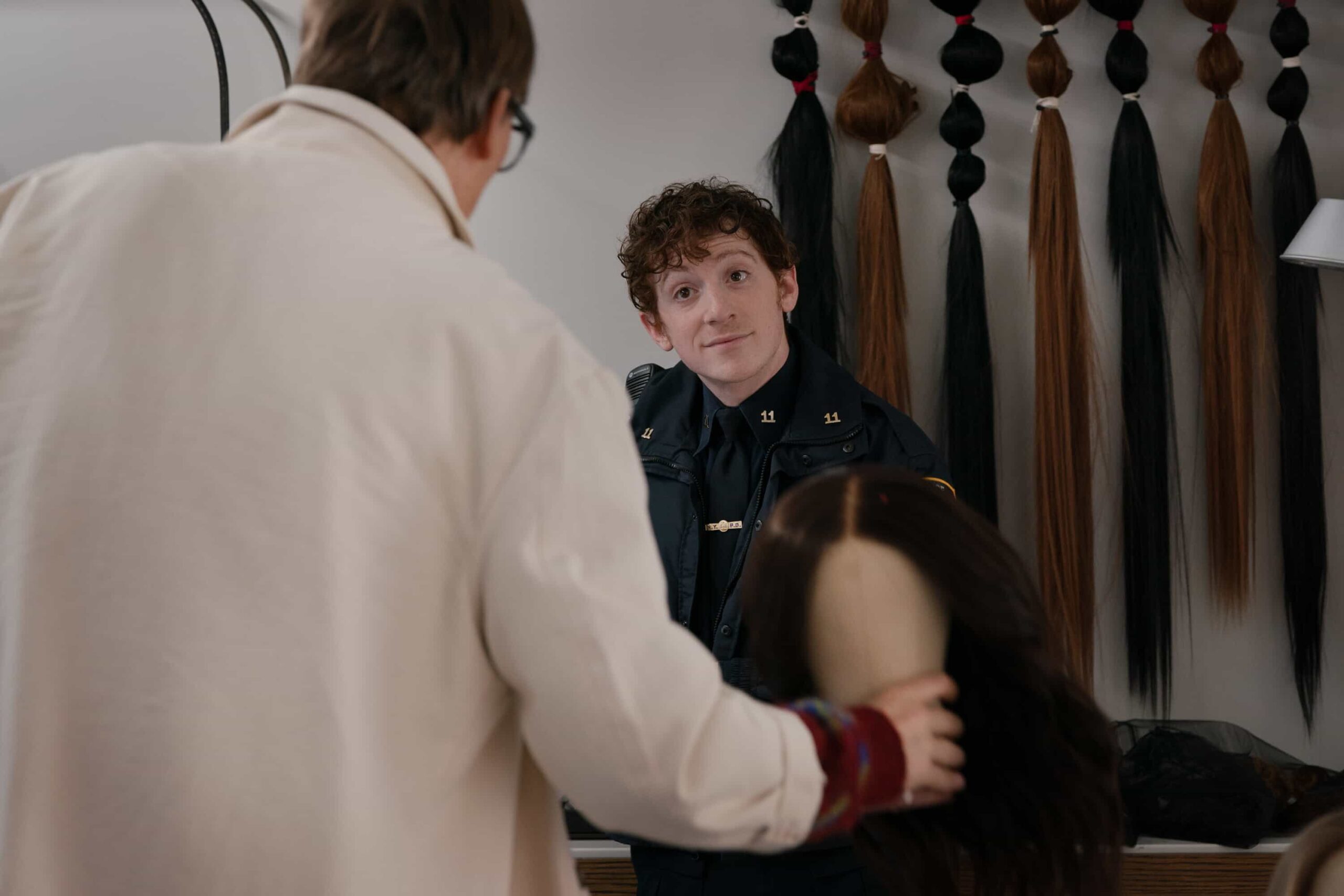 Elsbeth Season 3 Episode 12 “All’s Hair” – When a celebrity wigmaker is murdered, Elsbeth must comb through a tangled mess of suspects – and some drag brunch mayhem – to clip a killer, on ELSBETH, Thursday, March 5 (10:00-11:00 PM, ET/PT) on the CBS Television Network, and streaming on Paramount+  Pictured (L-R):  Jeff Hiller as Felix Weaver and Ethan Slater as Officer Reese Chandler   Photo: Michael Parmelee/CBS ©2025 CBS Broadcasting, Inc. All Rights Reserved.